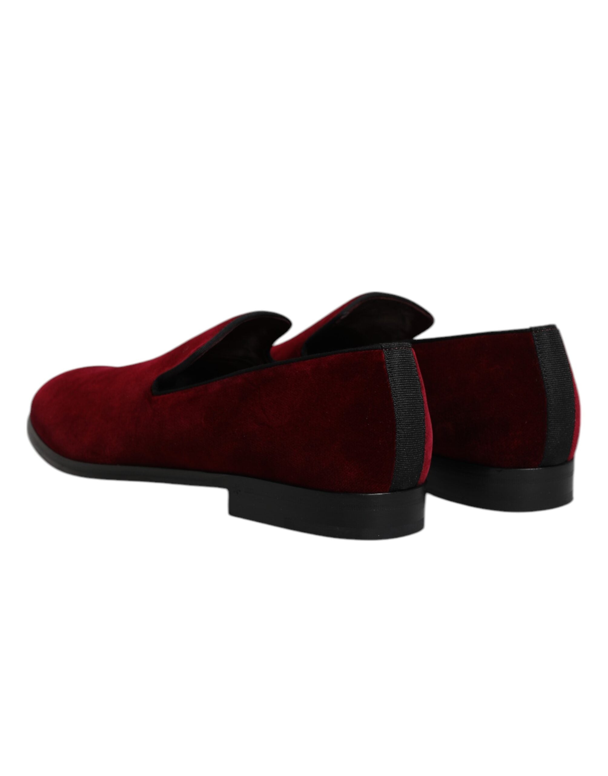 Indulge in the exquisite Dolce & Gabbana Red Cotton Velvet Slip On Loafers, where luxurious craftsmanship meets timeless elegance, perfect for the discerning connoisseur.