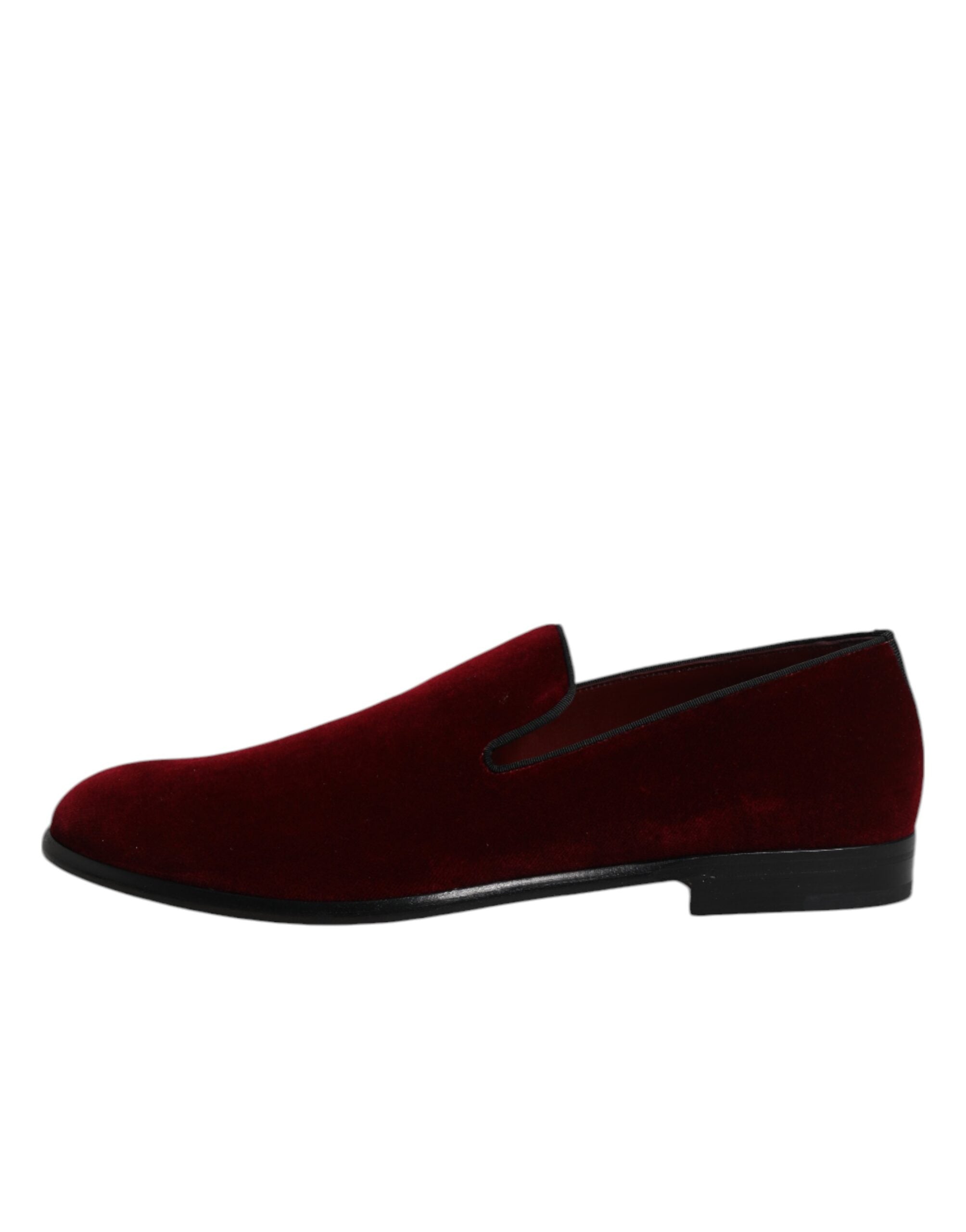 Step into a world of opulence with Dolce & Gabbana Red Cotton Velvet Slip On Loafers, where exquisite craftsmanship meets timeless elegance for the discerning individual.