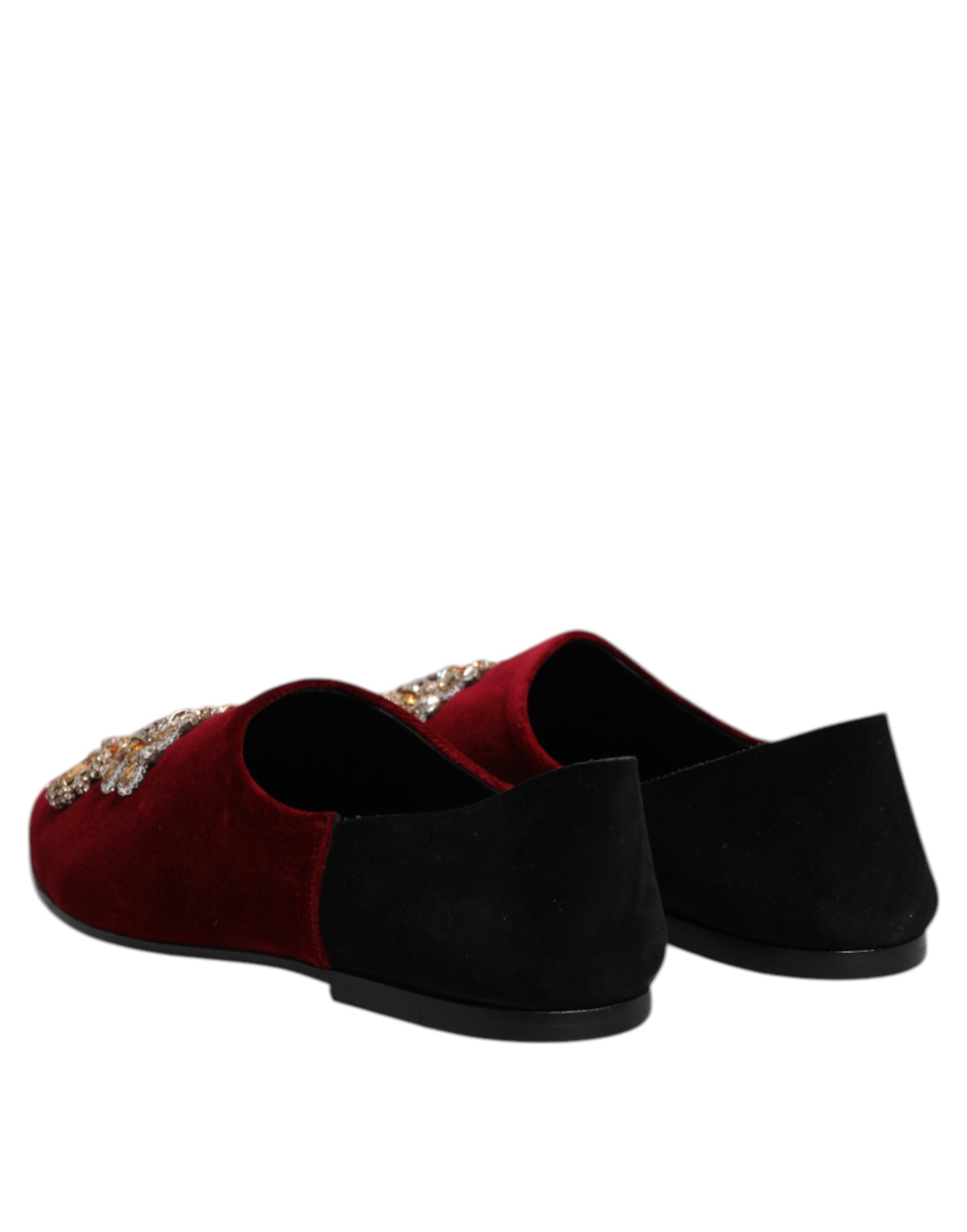 Indulge in the exquisite Dolce & Gabbana Black Red Velvet Embellished Slip On Shoes, where luxurious craftsmanship meets timeless elegance, perfect for the discerning individual.