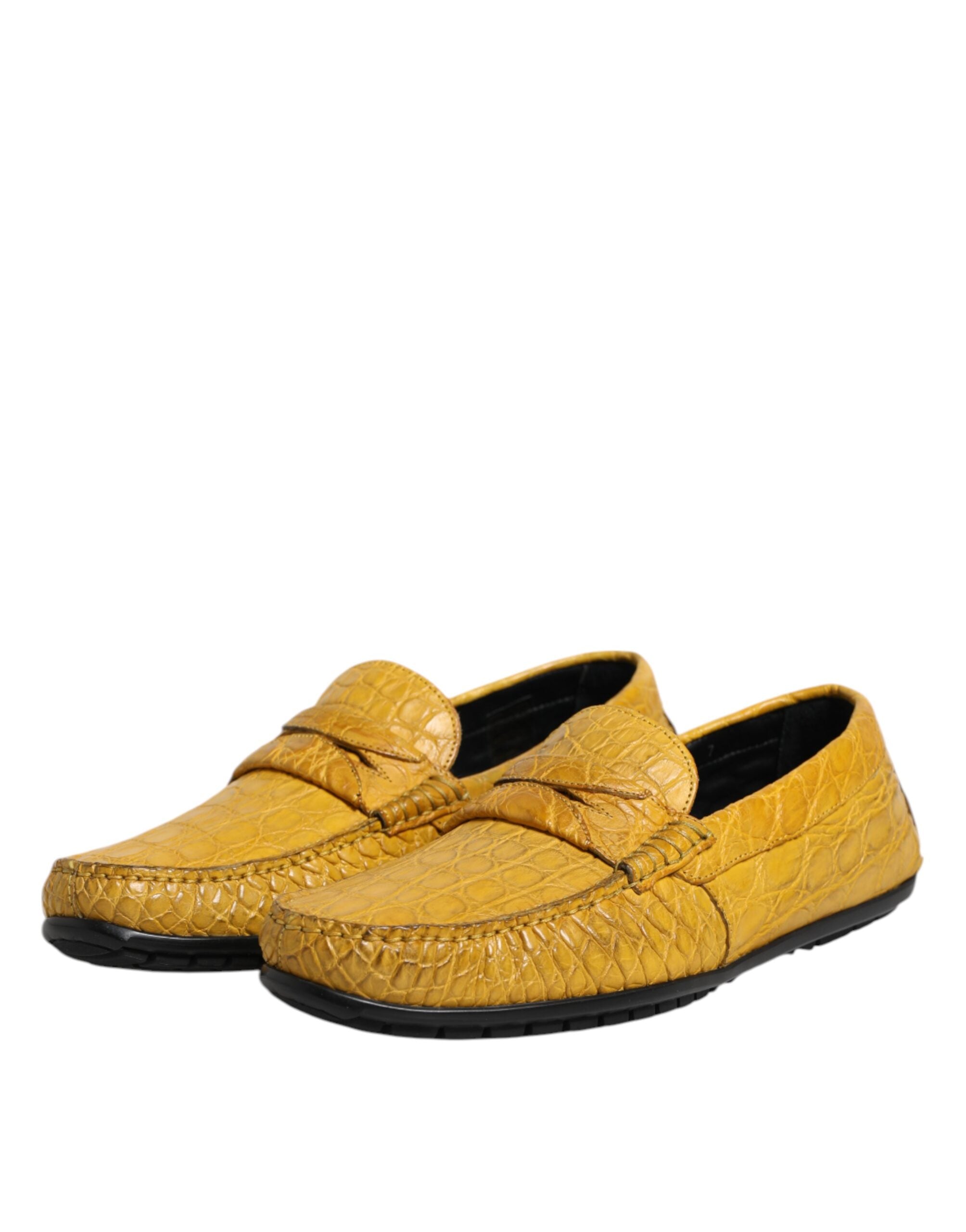 Step into unparalleled elegance with Dolce & Gabbana's Yellow Exotic Leather Loafers, crafted from luxurious Caiman leather, embodying sophistication and artistry for the discerning individual.