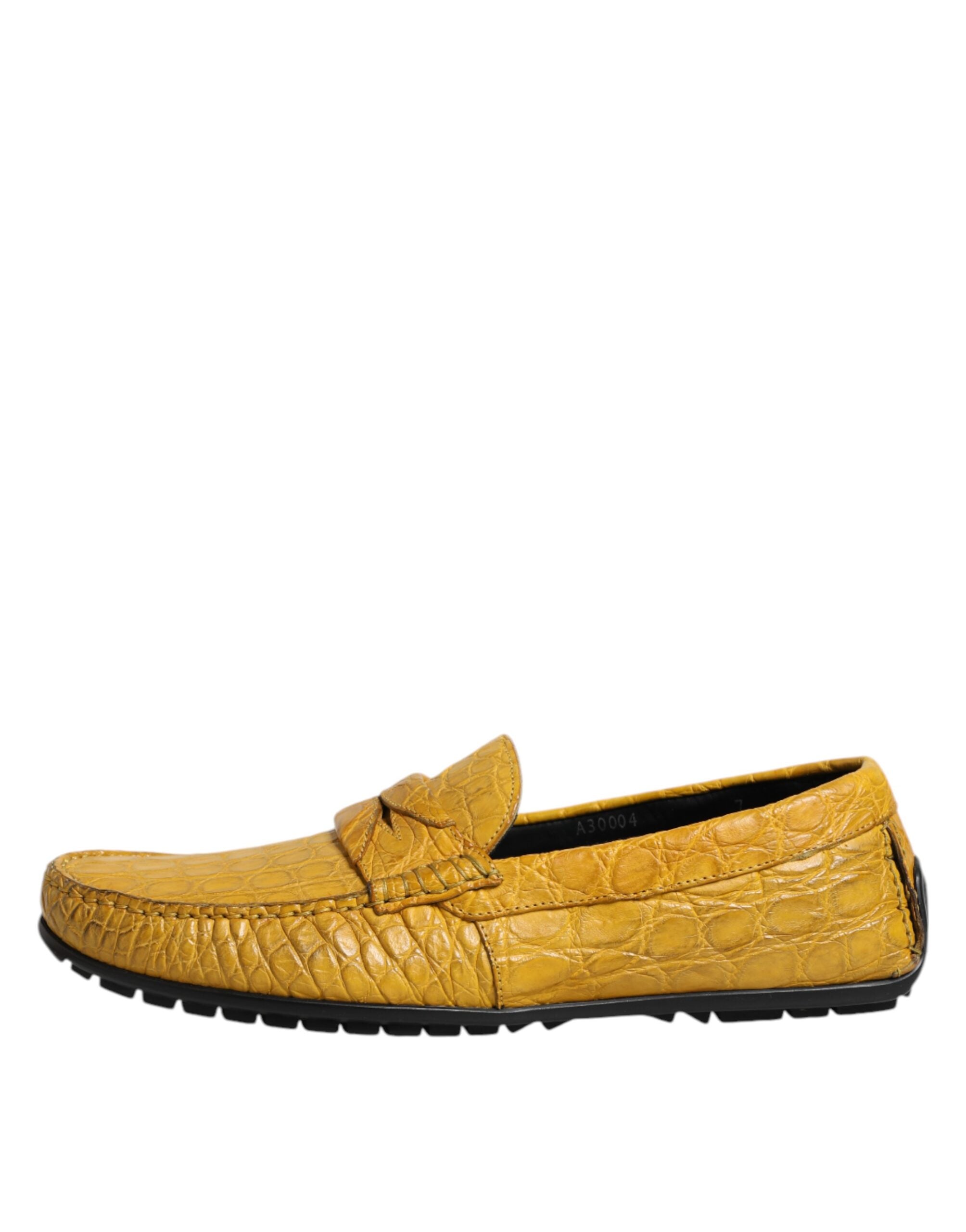 Experience the allure of Dolce & Gabbana's Yellow Exotic Leather Loafers, crafted from sumptuous Caiman leather, embodying luxury and sophistication for the discerning individual.