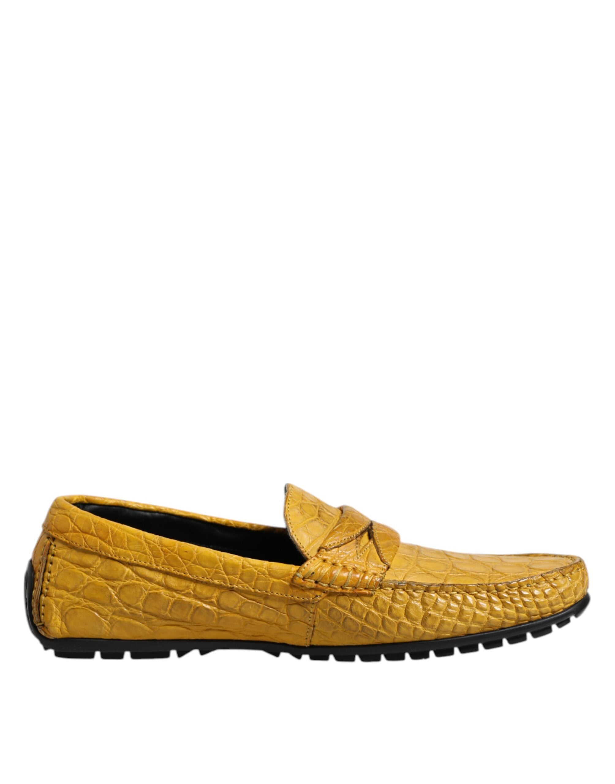 Experience the allure of Dolce & Gabbana's Yellow Exotic Leather Loafers, crafted from luxurious Caiman leather, embodying sophistication and timeless elegance for the discerning individual.