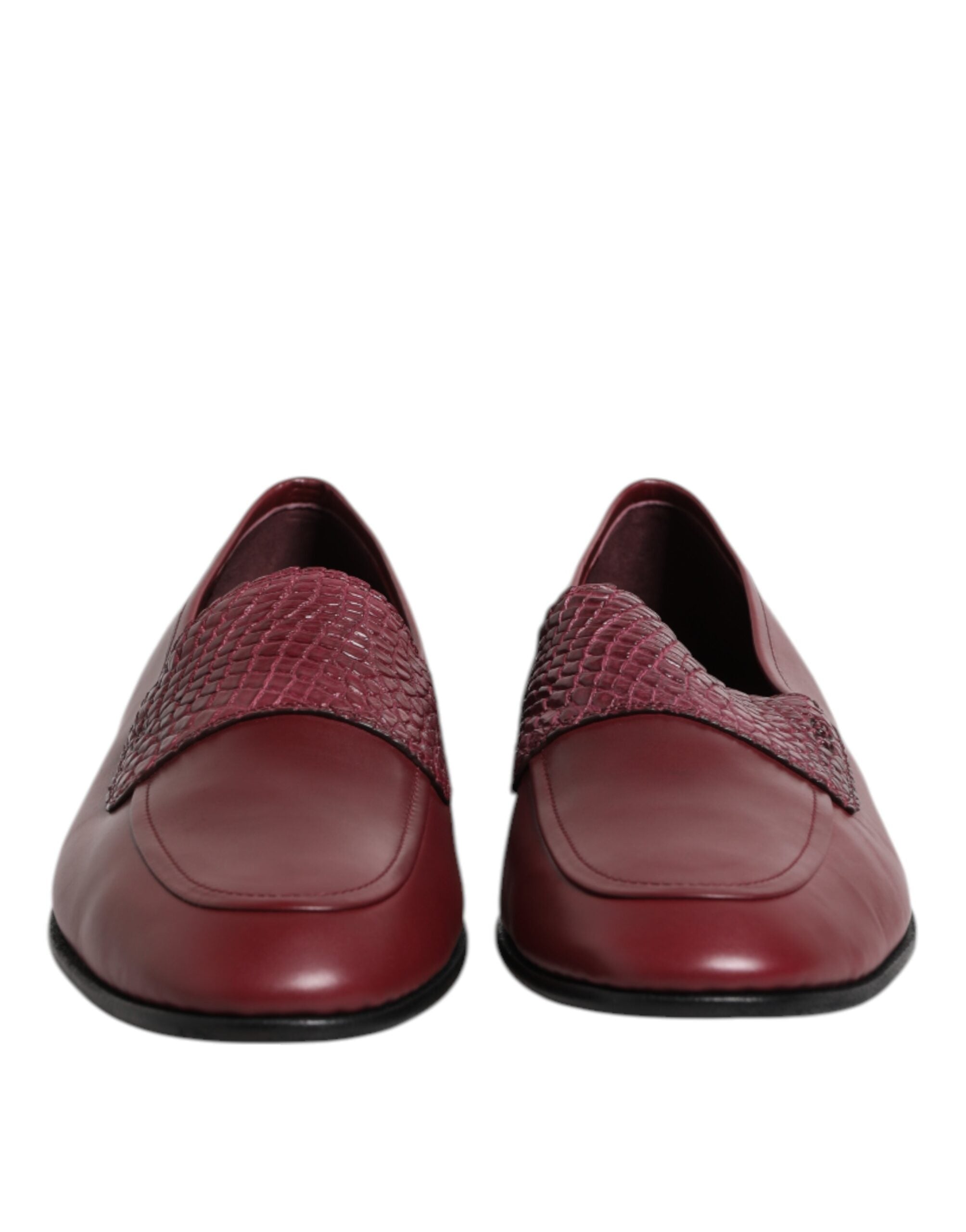 Elevate your elegance with Dolce & Gabbana's Burgundy Calfskin Leather Formal Slip On Shoes, where exquisite craftsmanship meets timeless sophistication for the discerning individual.