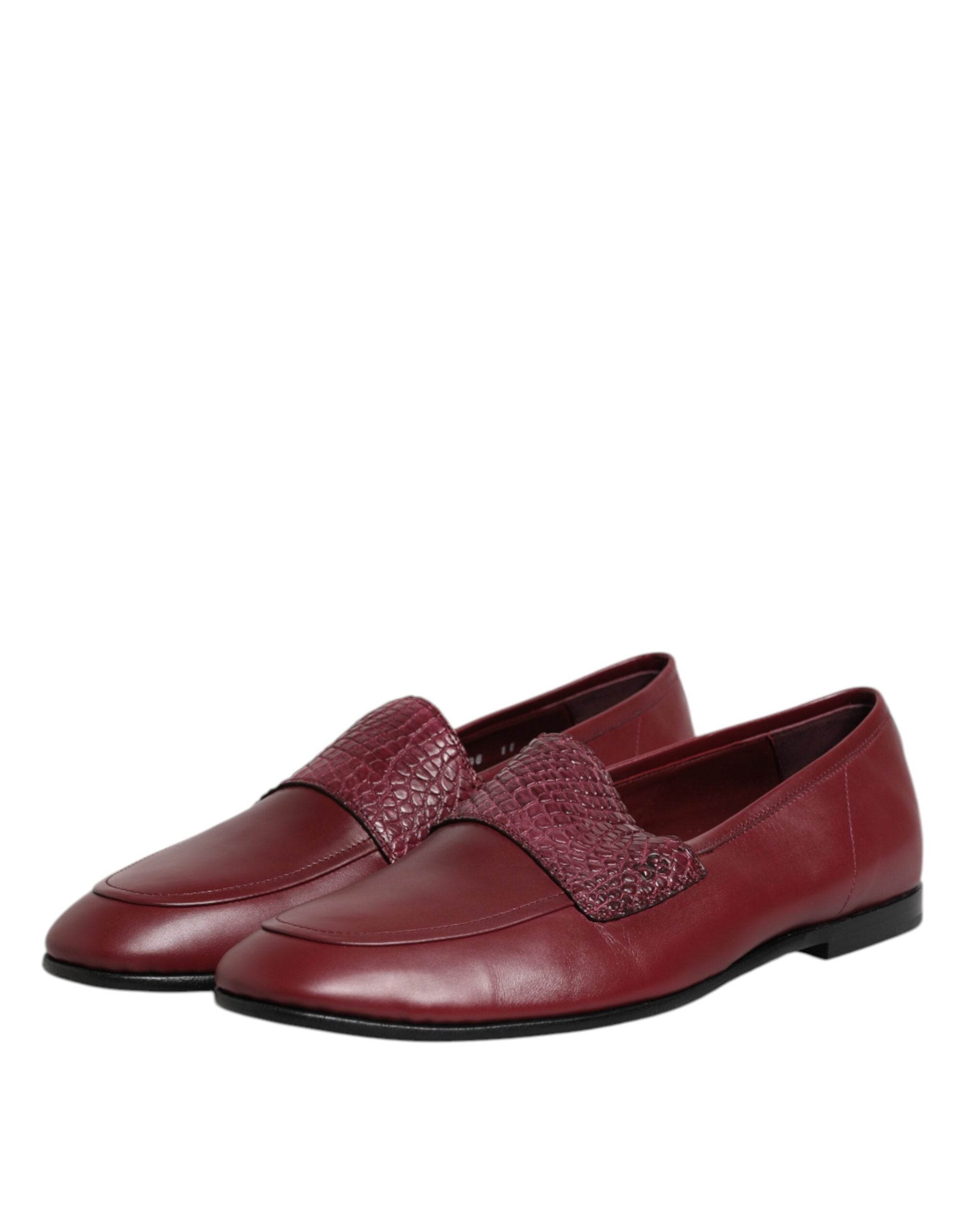 Experience the allure of Dolce & Gabbana's Burgundy Calfskin Leather Formal Slip On Shoes, where exquisite craftsmanship meets timeless elegance for the discerning individual.