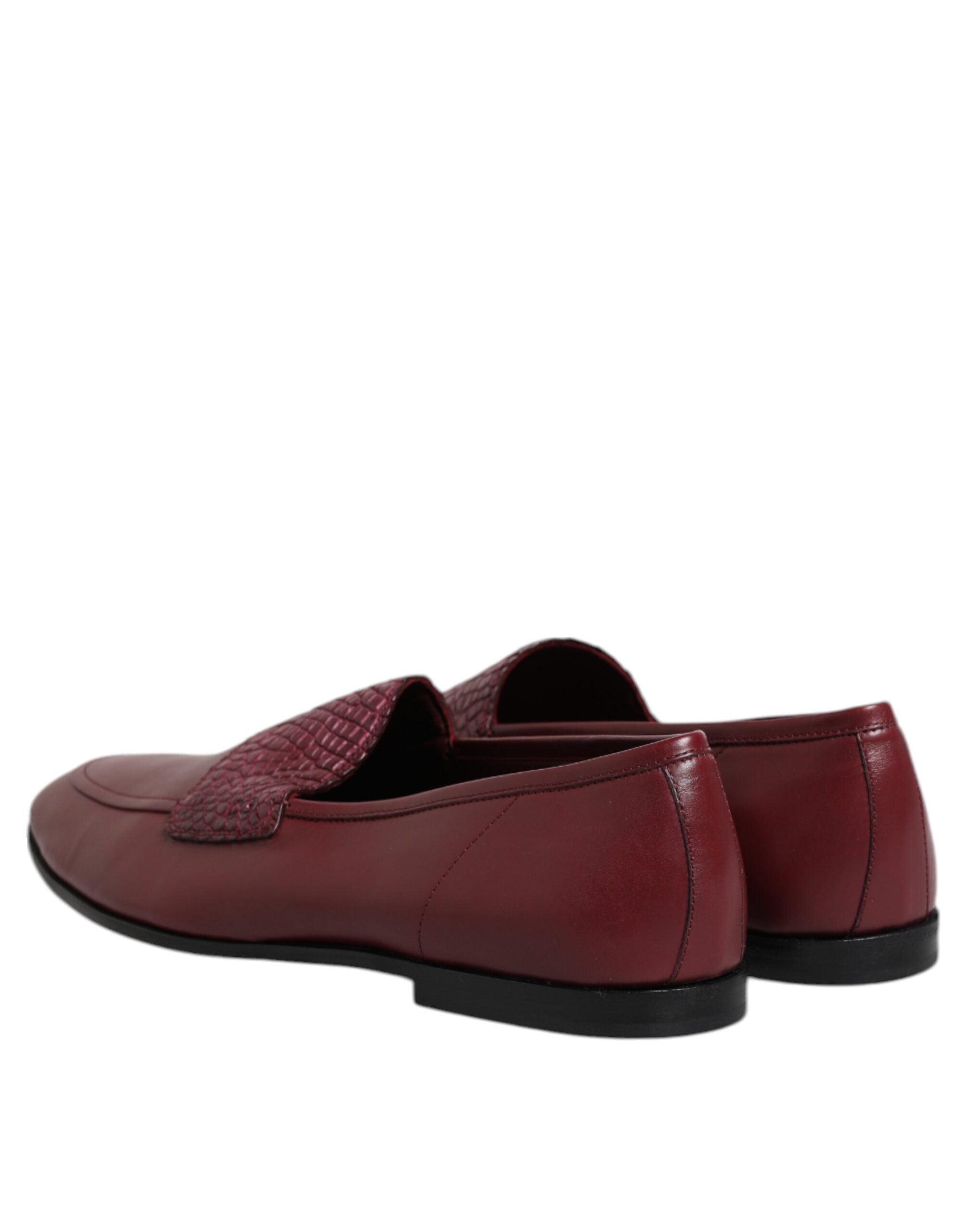 Elevate your wardrobe with Dolce & Gabbana's Burgundy Calfskin Leather Formal Slip On Shoes, where exquisite craftsmanship meets timeless elegance for the discerning individual.