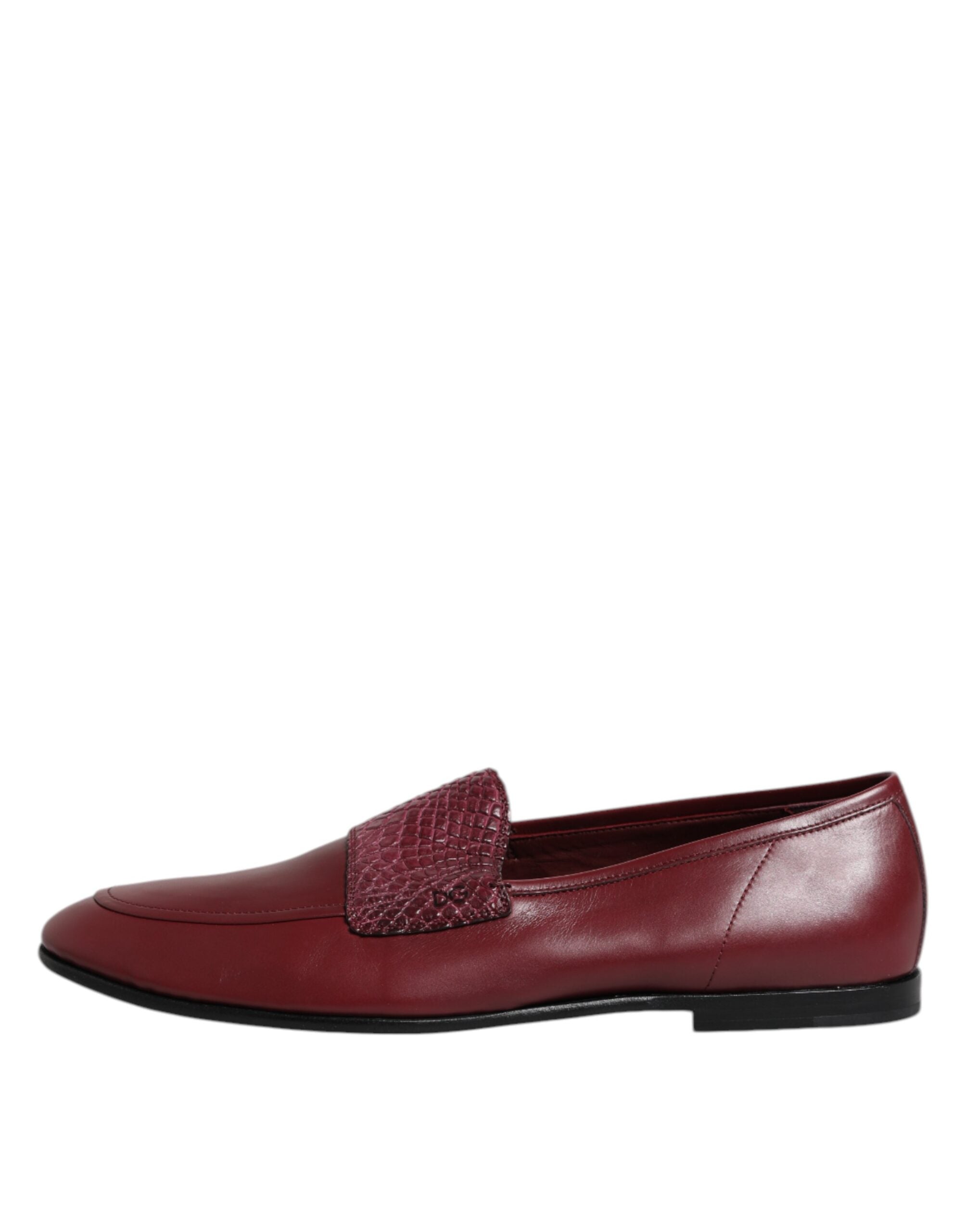 Elevate your style with Dolce & Gabbana's Burgundy Calfskin Leather Formal Slip On Shoes, a masterpiece of Italian craftsmanship and luxury that embodies sophistication and allure.