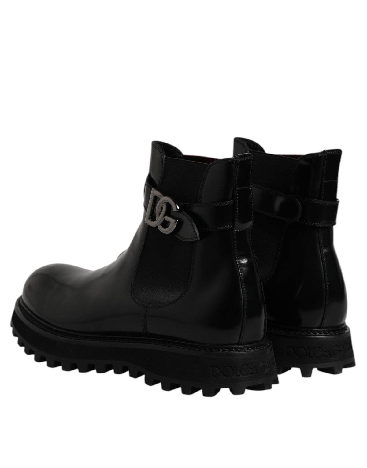 Step into unparalleled elegance with Dolce & Gabbana's Black Belted DG Logo Chelsea Boots, crafted from premium calf leather for a timeless, luxurious allure.