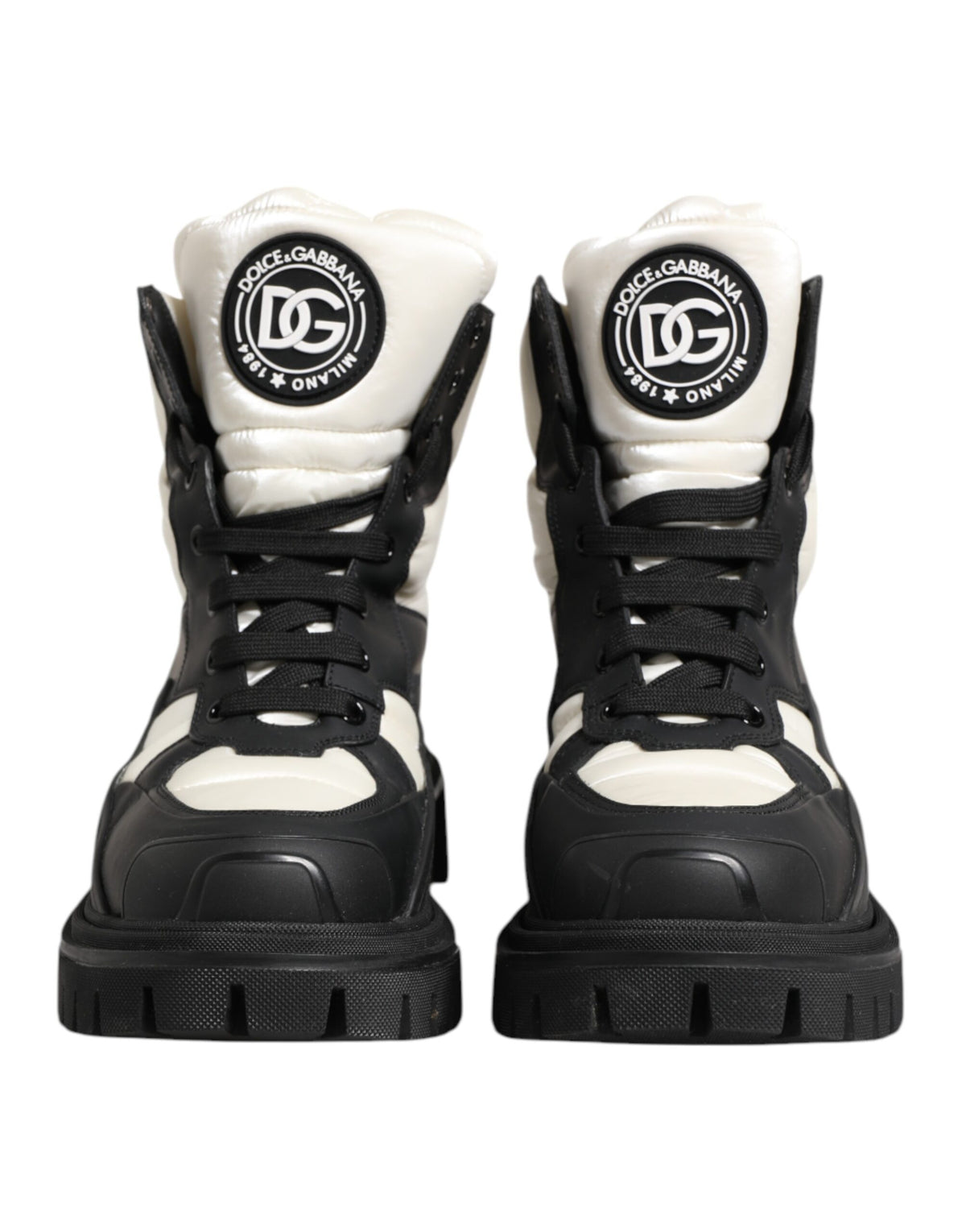 Experience the exquisite craftsmanship of Dolce & Gabbana's Black White Padded Lace Up Short Boots, where luxury meets timeless elegance for the discerning individual.