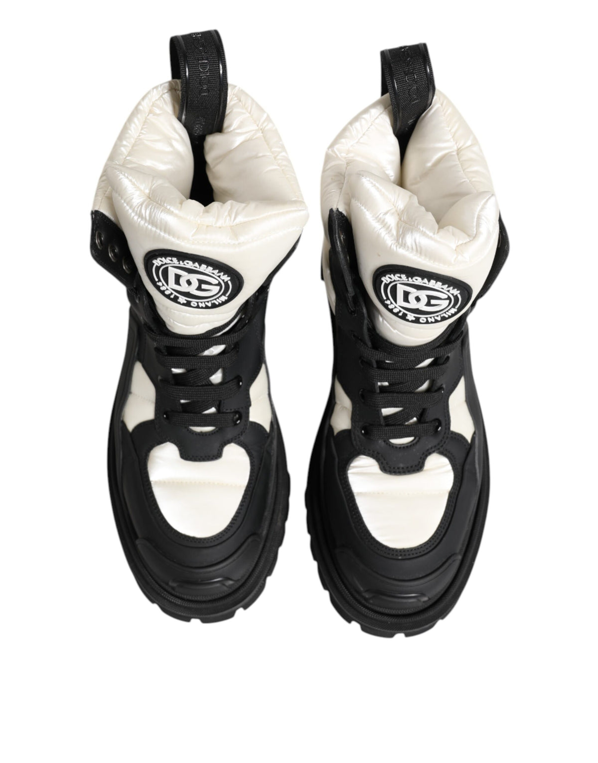 Experience the allure of Dolce & Gabbana's Black White Padded Lace Up Short Boots, where Italian craftsmanship meets luxurious design, perfect for the discerning individual.