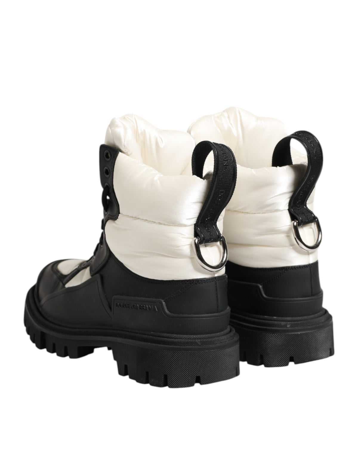 Experience the allure of Dolce & Gabbana's Black White Padded Lace Up Short Boots, where exquisite craftsmanship meets timeless elegance for the discerning individual.