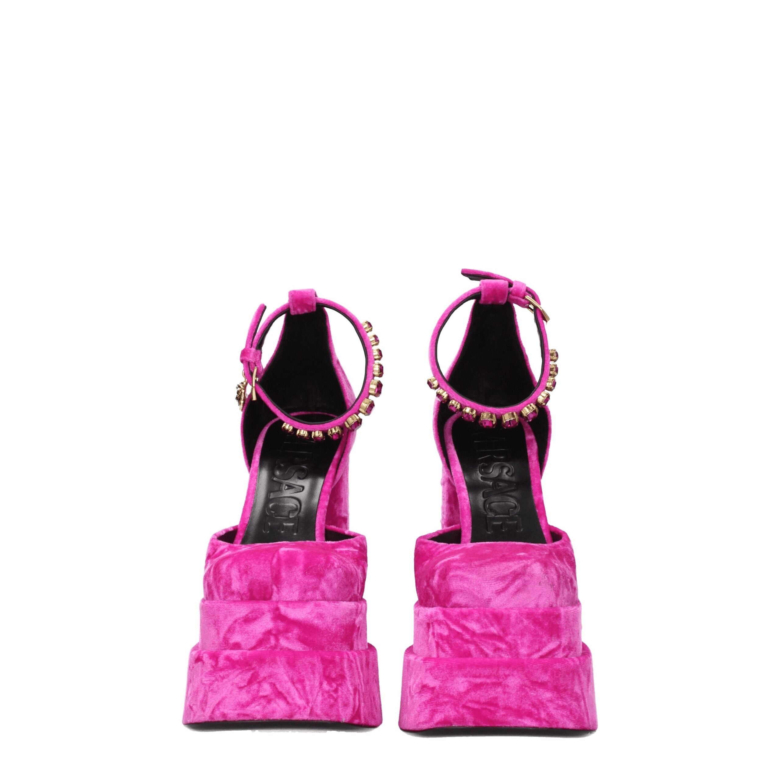 Elevate your evening allure with Versace Pink Velvet Platform Sandals, a luxurious statement crafted in plush fuchsia velvet, adorned with radiant rhinestones for timeless elegance.