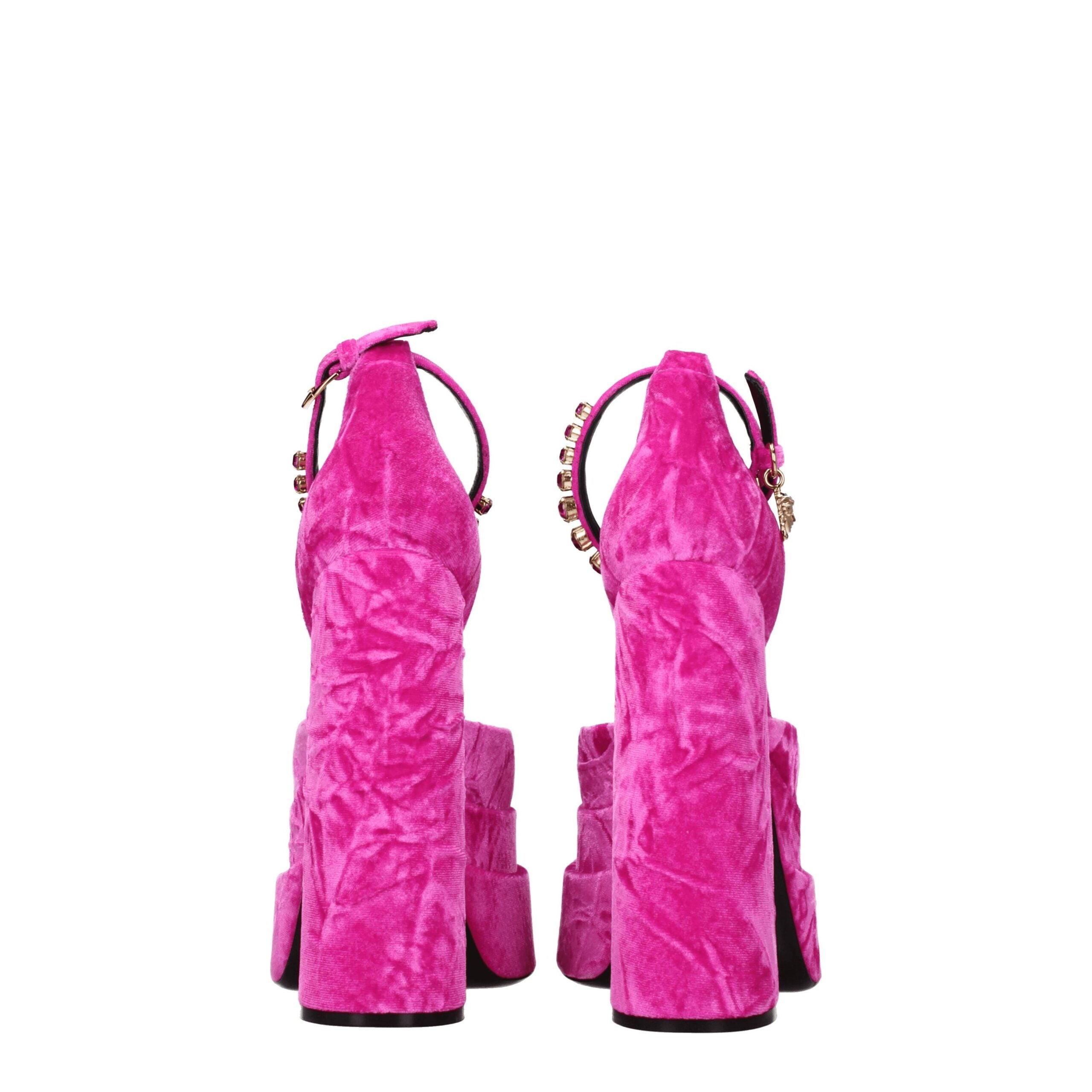Elevate your evening allure with Versace Pink Velvet Platform Sandals, a luxurious statement of fuchsia velvet and radiant rhinestones, perfect for haute couture moments.