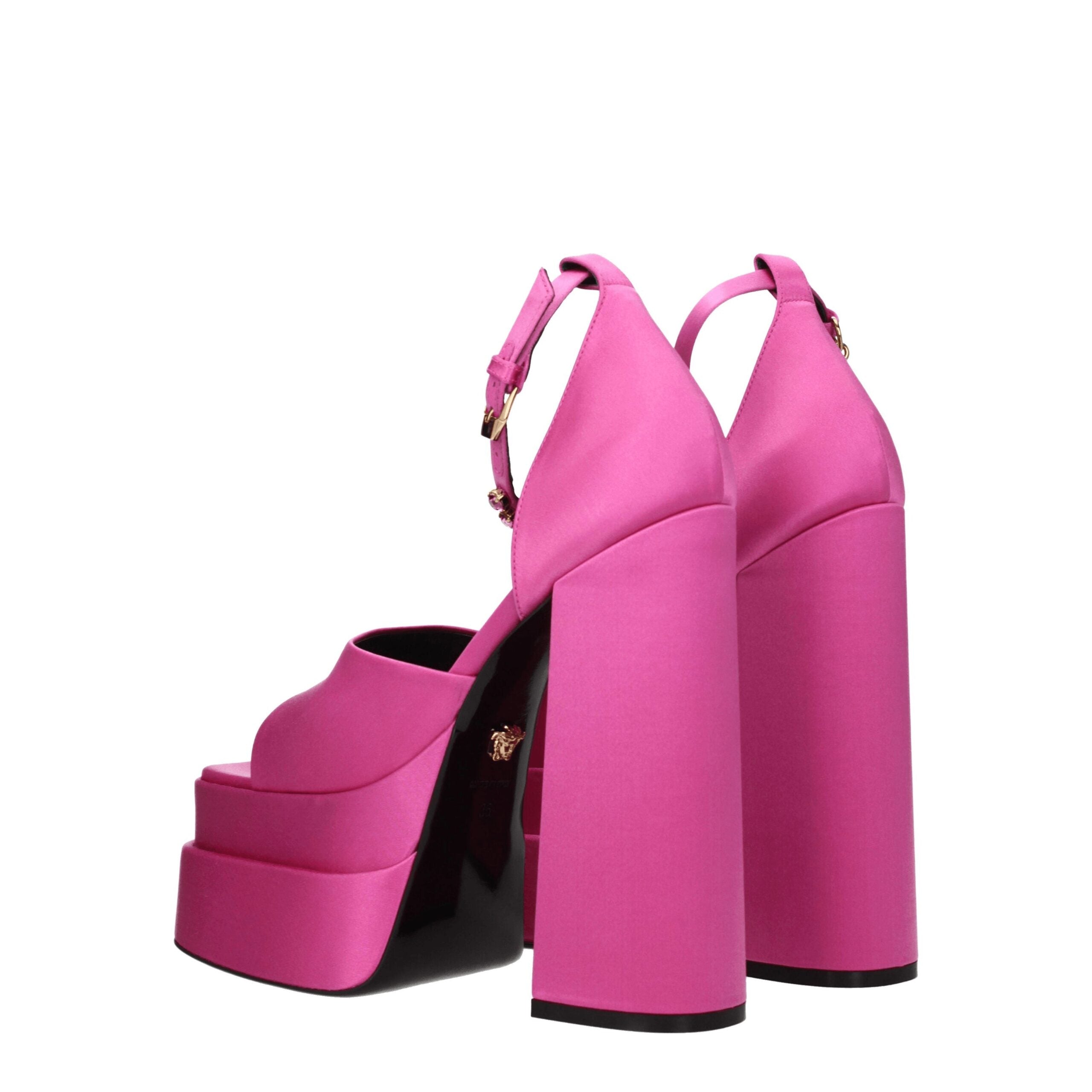 Elevate your elegance with Versace Pink Satin Platform Sandals, where exquisite craftsmanship meets luxurious satin and radiant rhinestones for a captivating statement.