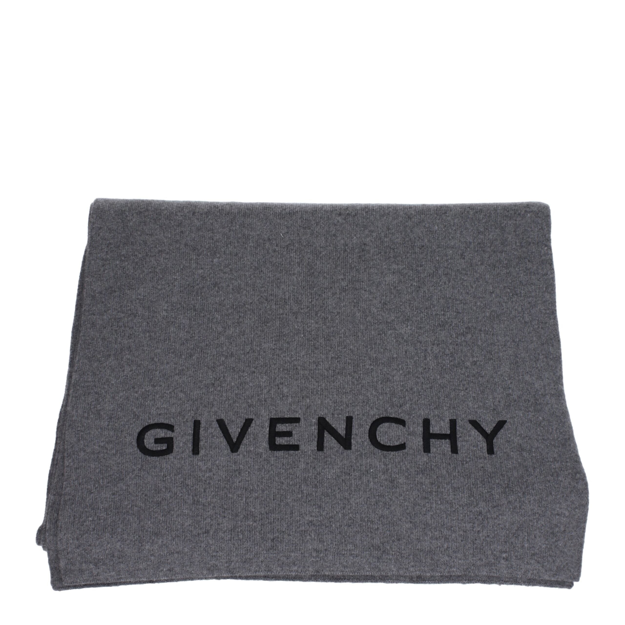 Indulge in the Givenchy Gray Wool Scarf, a luxurious blend of wool and cashmere, elevating your style with timeless elegance and unmatched versatility for every occasion.