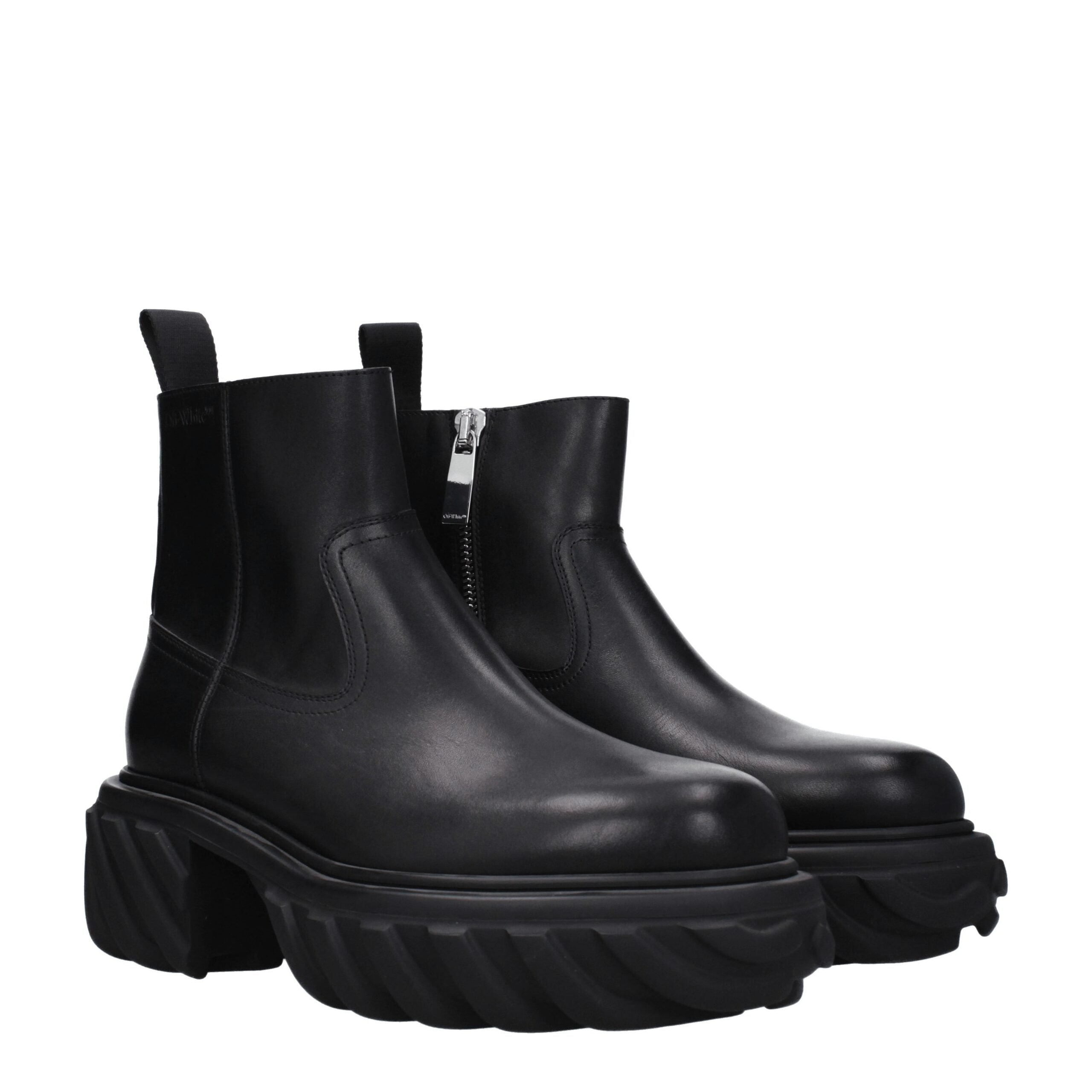 Discover the Off-White Black Leather Ankle Boots, where exquisite craftsmanship meets timeless elegance, perfect for the discerning individual who values luxury.