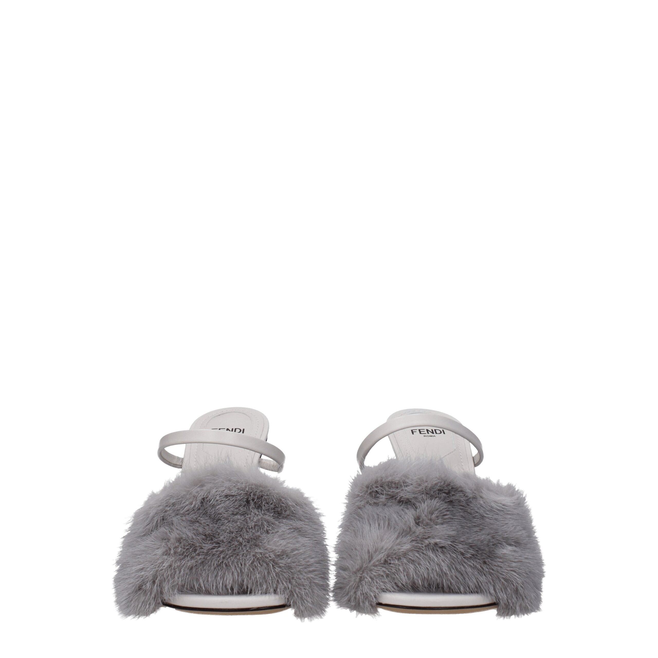 Indulge in the Fendi Gray Mink Slippers, a masterpiece of exquisite craftsmanship in sumptuous gray mink and premium leather, elevating your elegance with every step.