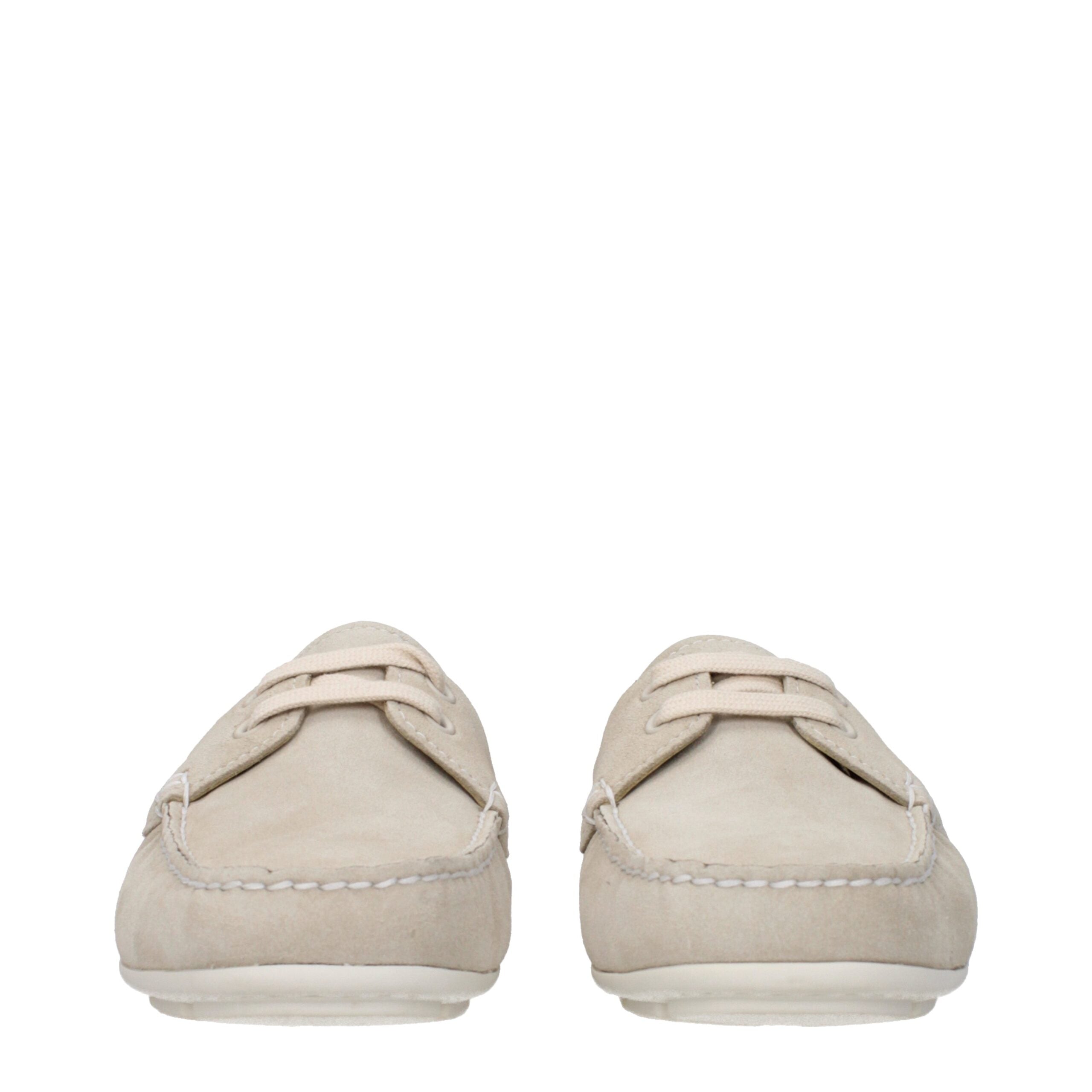 Experience the exquisite craftsmanship of Prada Gray Leather Slip-On Loafers, where luxurious gray suede meets timeless elegance for the discerning individual.