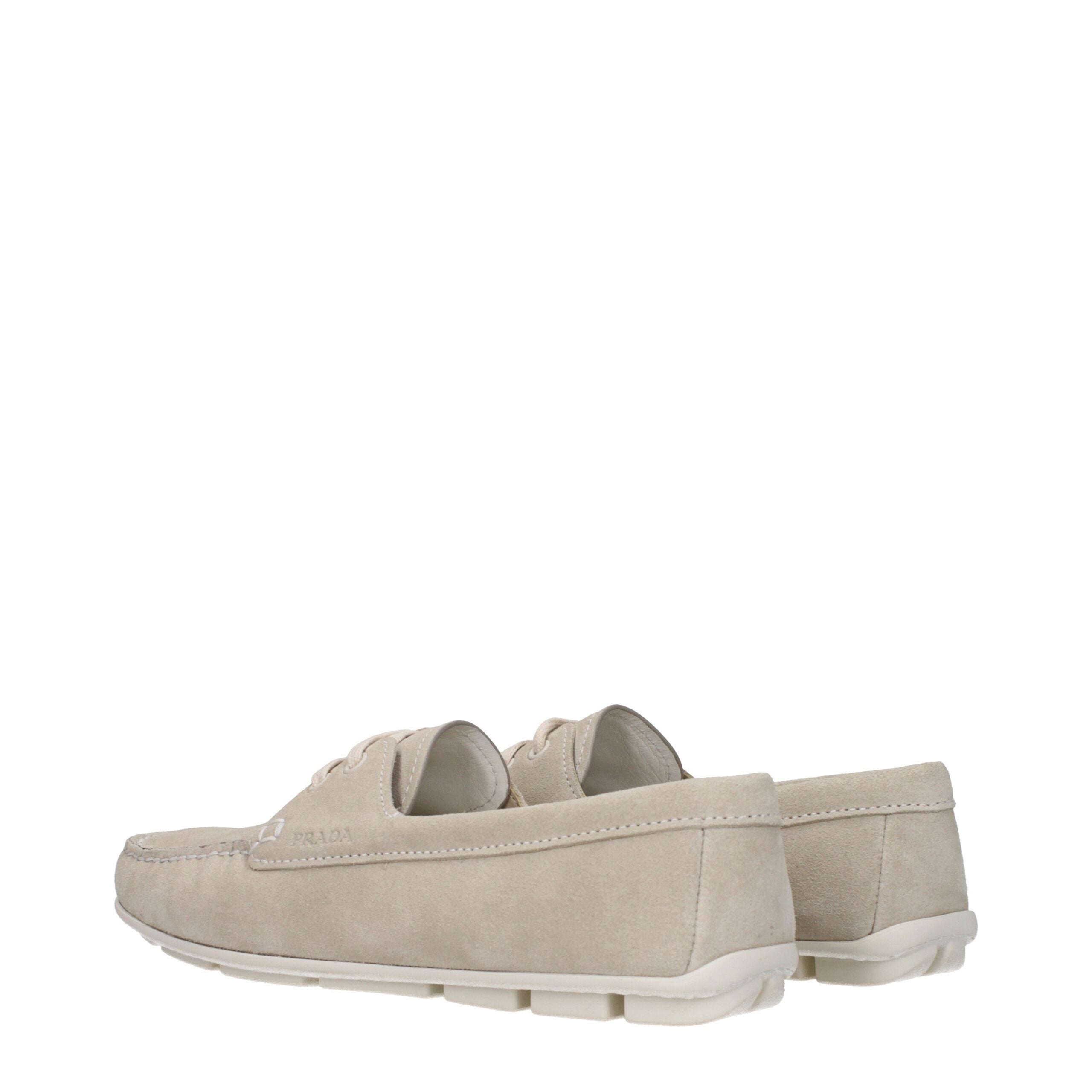Discover the Prada Gray Leather Slip-On Loafers, crafted from premium suede for timeless elegance and versatile style, perfect for the discerning individual.