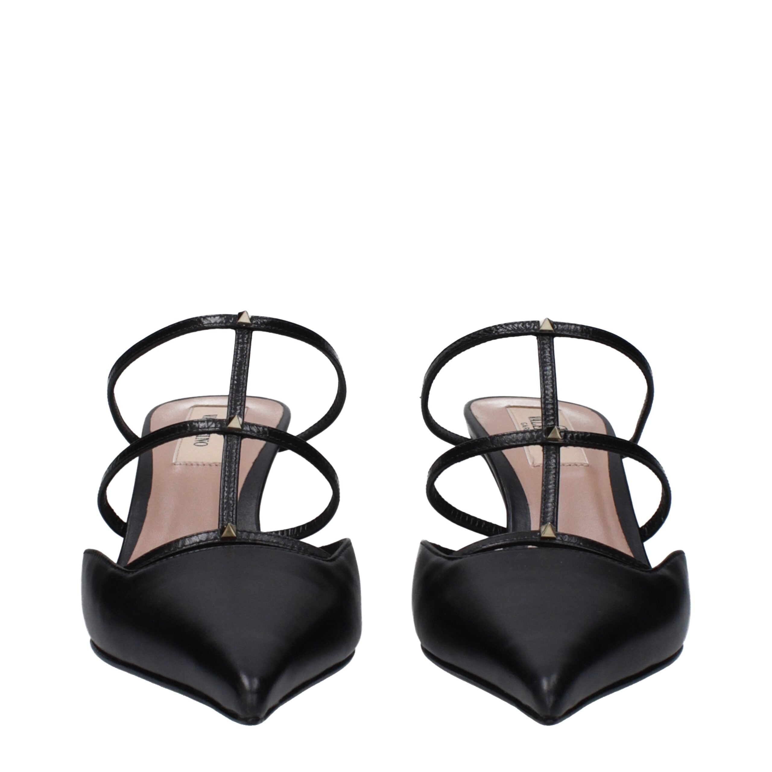 Indulge in the exquisite Valentino Garavani Black Leather Flat Sandals, where luxurious craftsmanship meets timeless elegance, perfect for the discerning connoisseur.