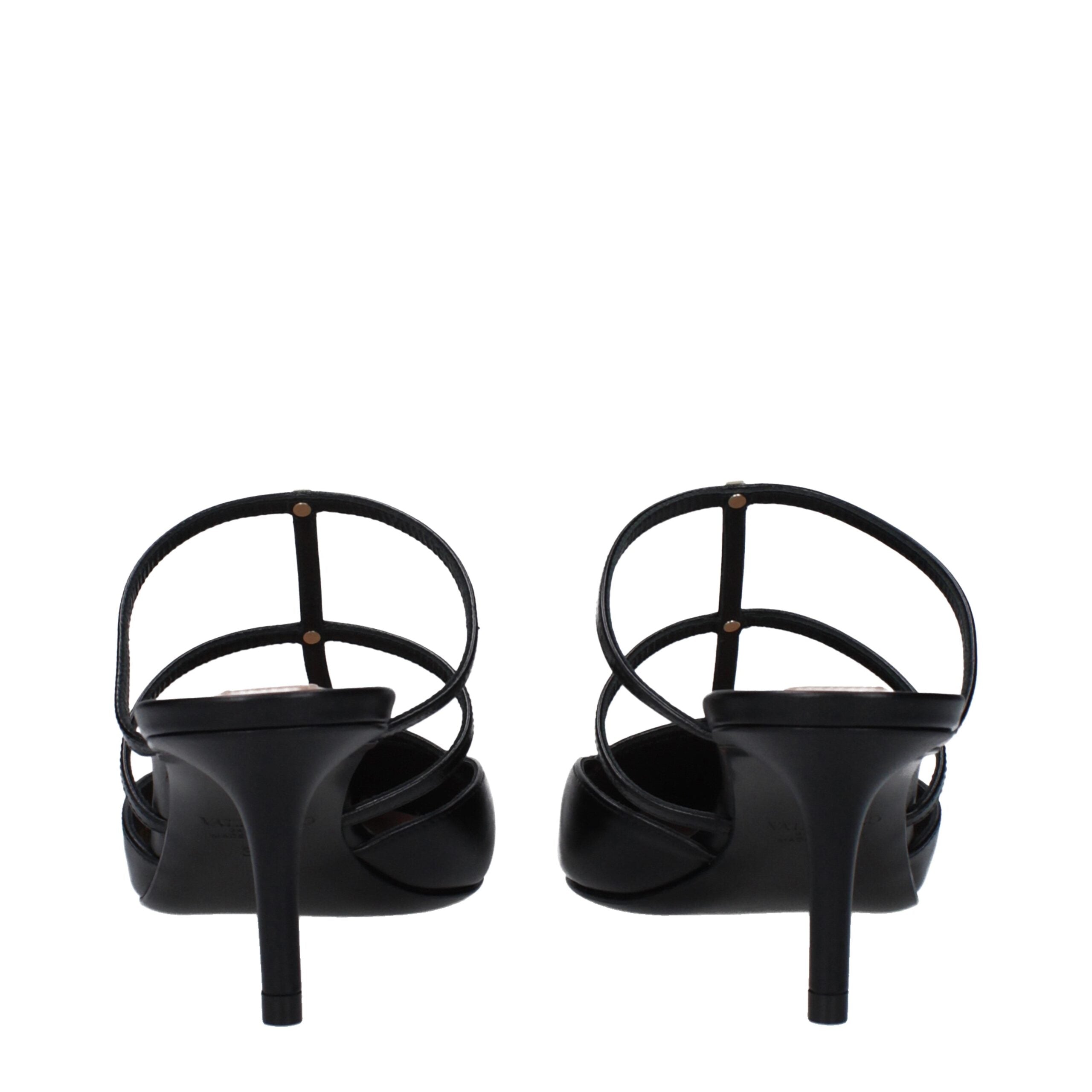 Discover the Valentino Garavani Black Leather Flat Sandals, where exquisite craftsmanship meets timeless elegance, perfect for those who embrace luxury with confidence.