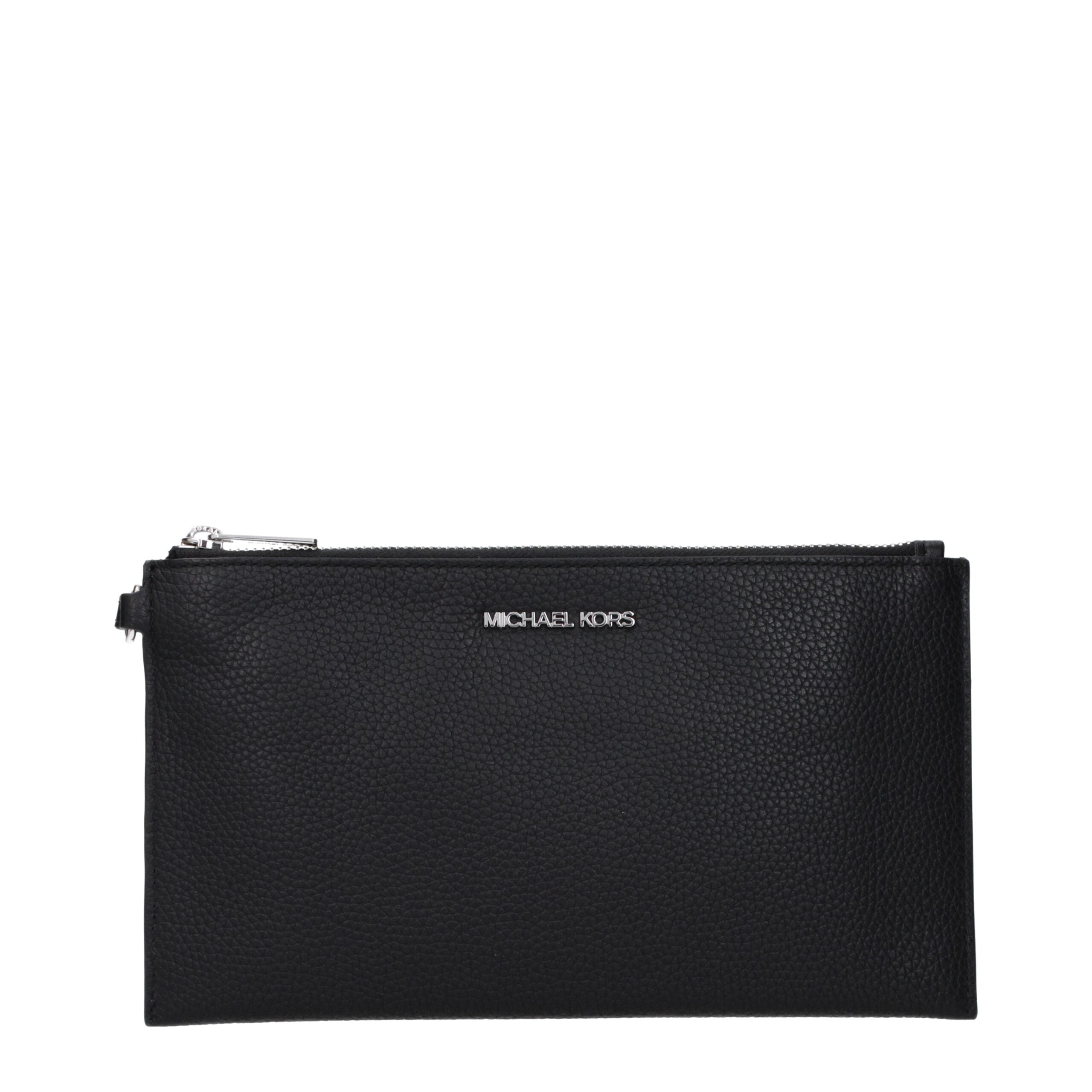 Discover the Michael Kors Black Leather Clutch Bag, a timeless creation of premium craftsmanship that elevates your evening attire with effortless sophistication.