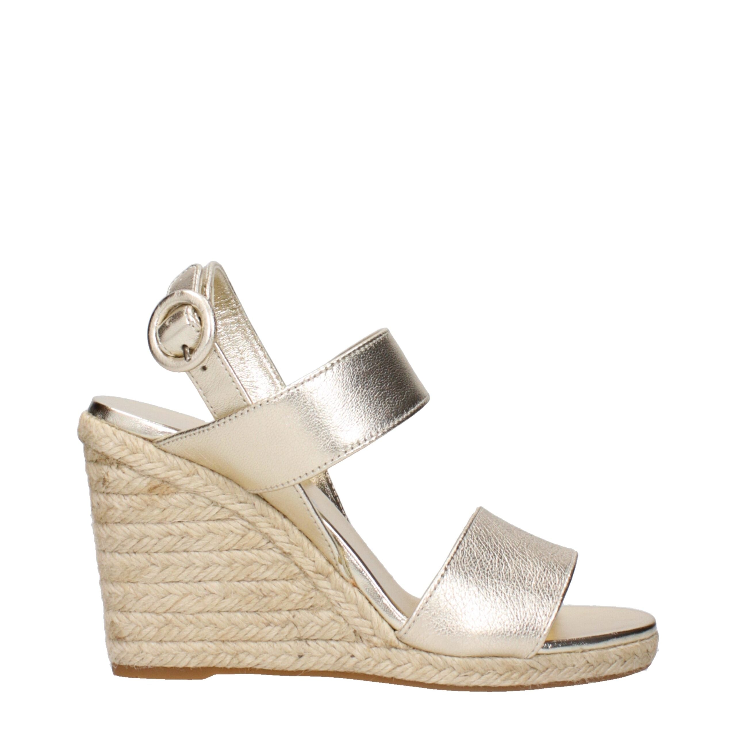 Elevate your style with Prada Gold Leather Wedge Sandals, where exquisite craftsmanship meets timeless allure, perfect for the modern connoisseur of luxury.
