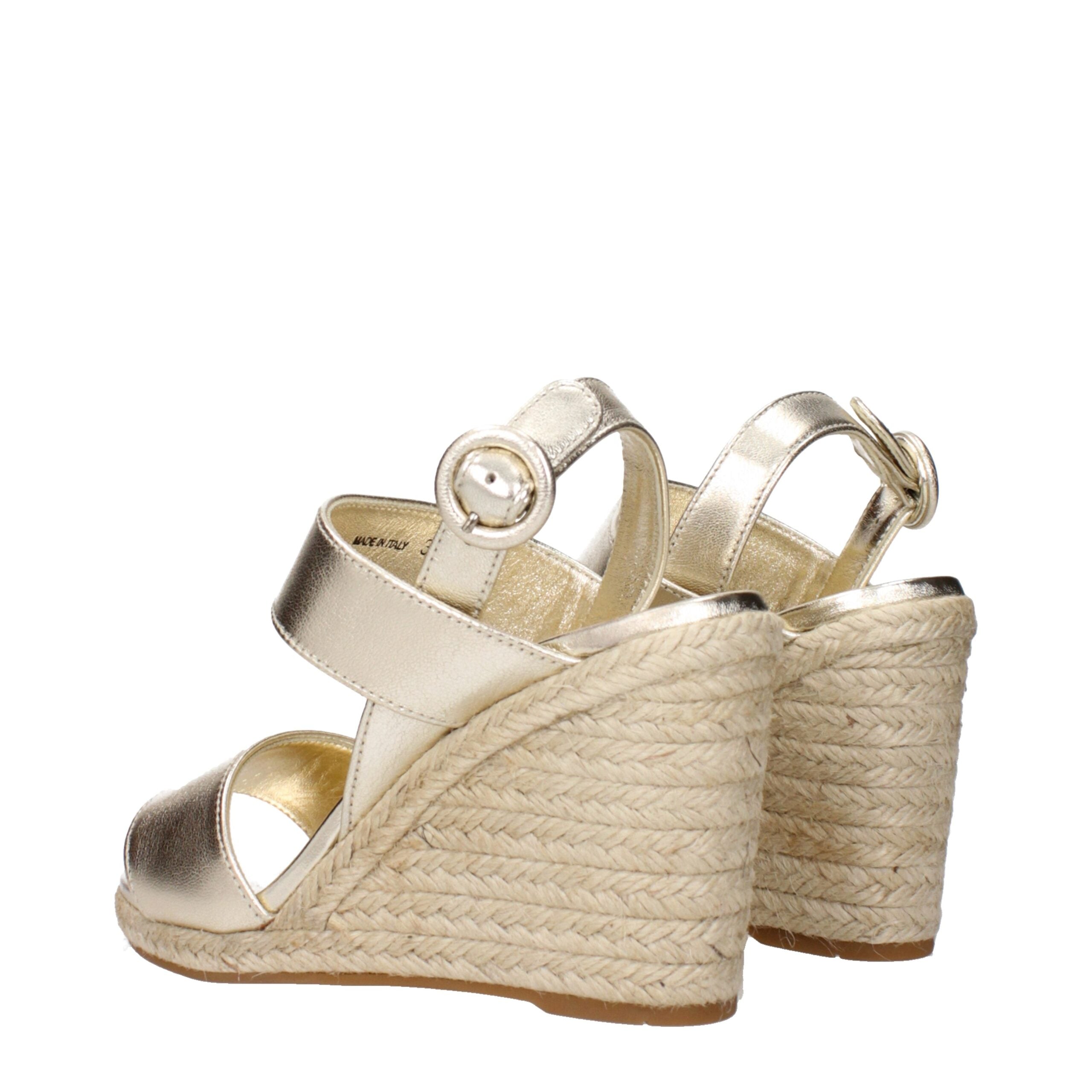 Elevate your style with Prada Gold Leather Wedge Sandals, where exquisite craftsmanship meets timeless allure, perfect for the discerning individual seeking luxury.