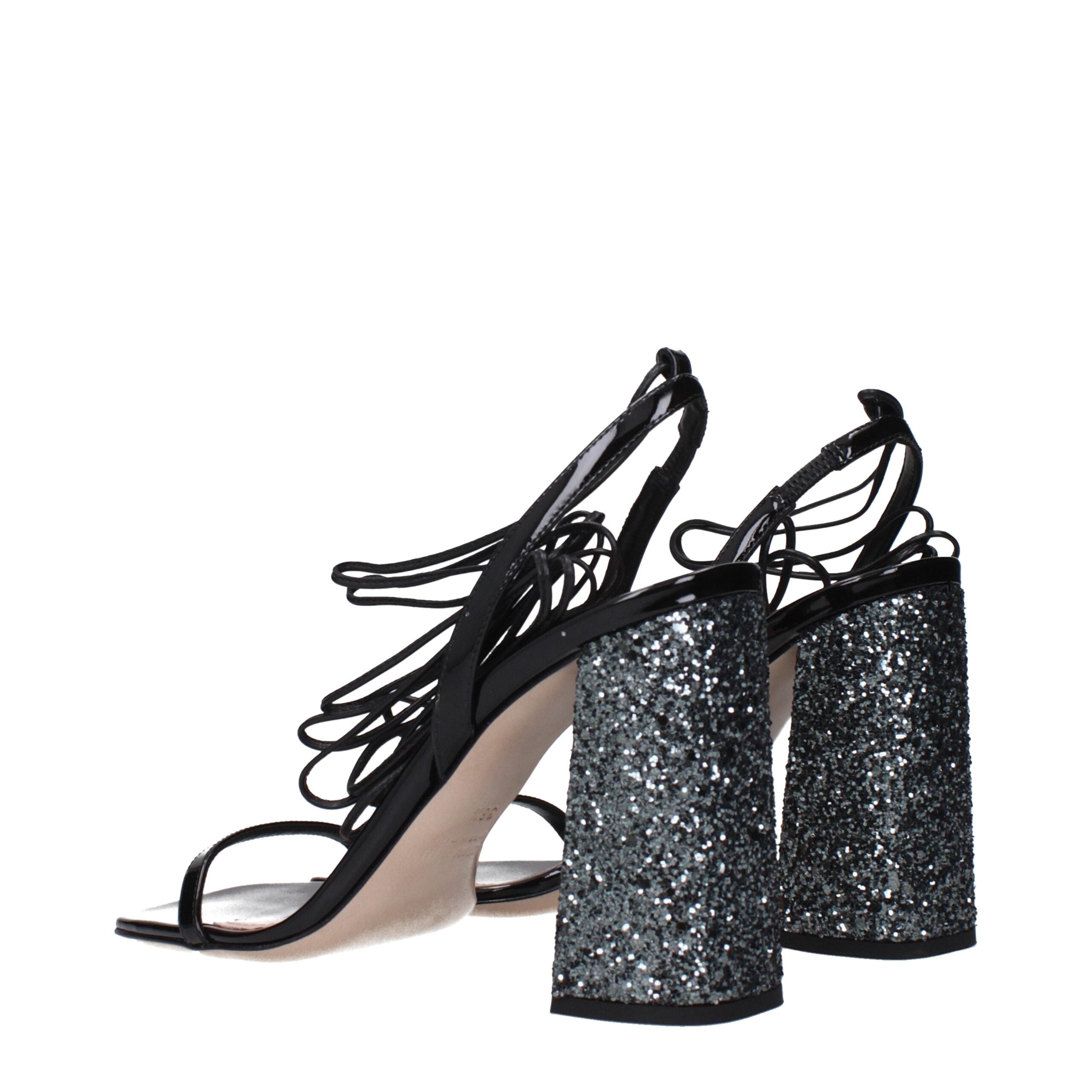 Experience the allure of Miu Miu Black Leather Platform Sandals from the Couture collection, where exquisite patent leather meets impeccable craftsmanship for timeless elegance.
