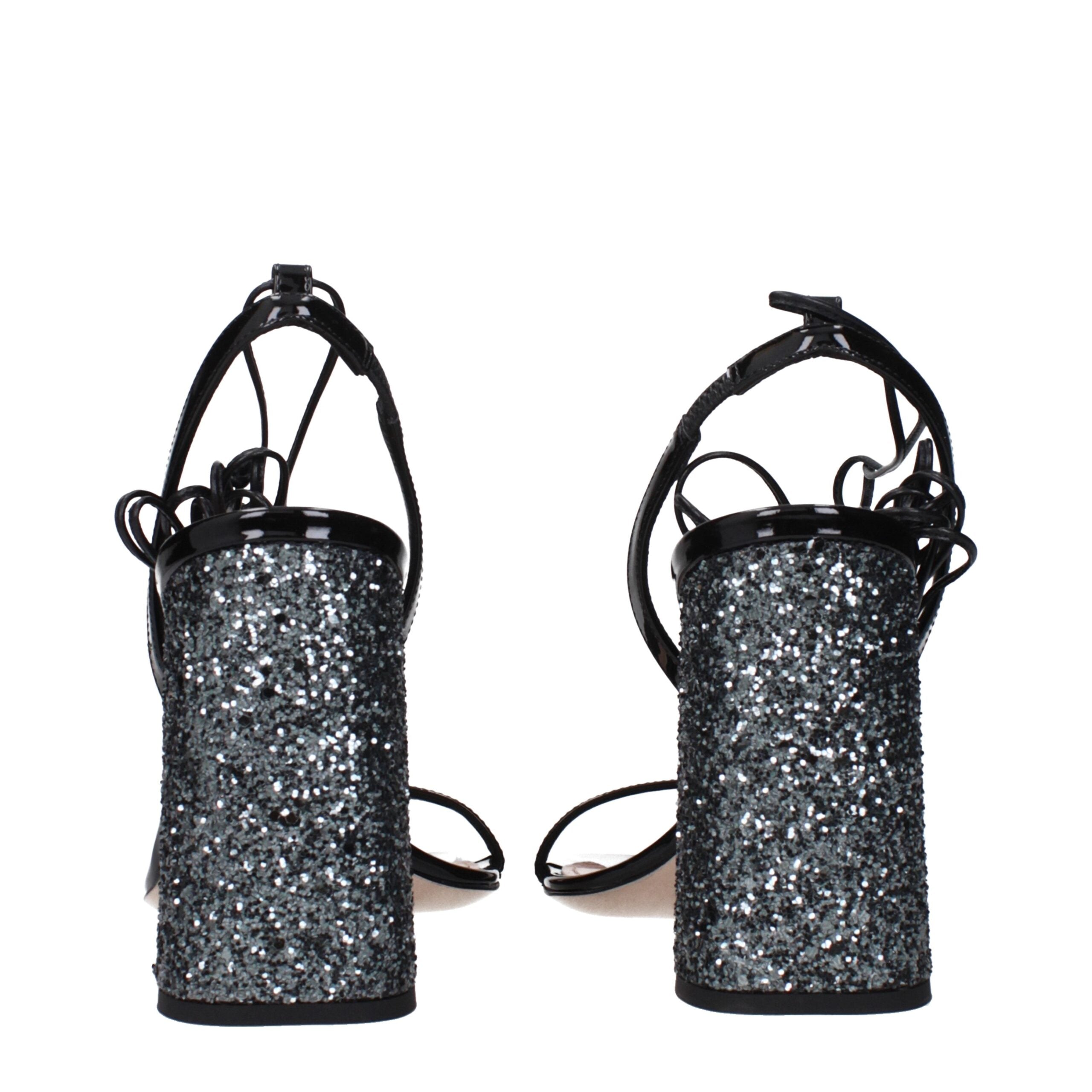 Experience the allure of Miu Miu Black Leather Platform Sandals from the Couture collection, where luxurious patent leather meets impeccable craftsmanship for timeless elegance.