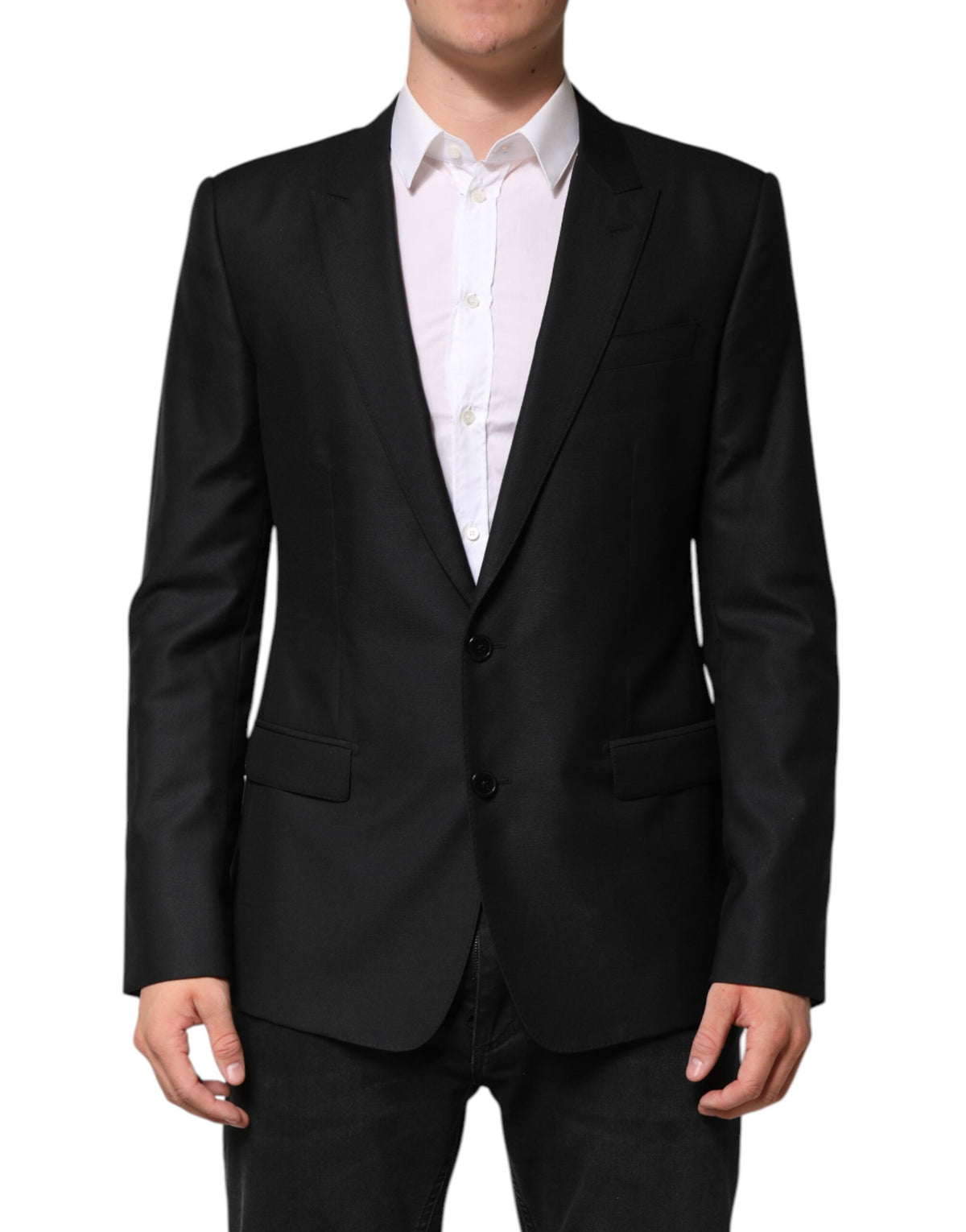 Indulge in the Dolce & Gabbana Black Wool Single Breasted Jacket Blazer, a masterpiece of Italian craftsmanship that embodies luxury and sophistication for every occasion.