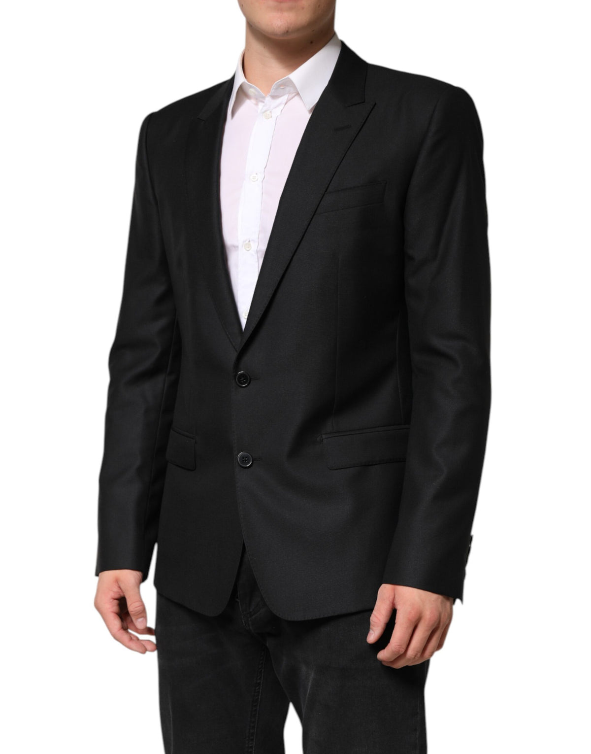 Indulge in the exquisite Dolce & Gabbana Black Wool Single Breasted Jacket Blazer, where luxurious virgin wool and silk meet impeccable Italian craftsmanship for timeless elegance.