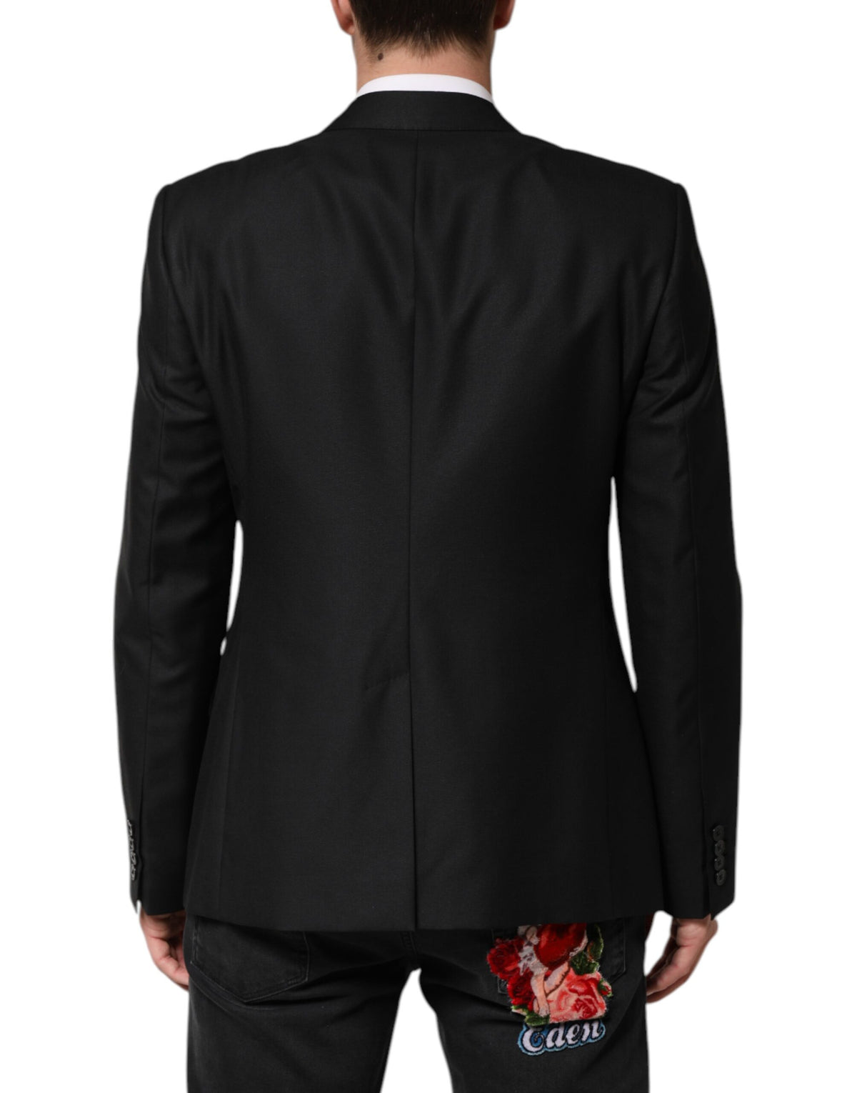 Elevate your wardrobe with the Dolce & Gabbana Black Wool Single Breasted Jacket Blazer, a masterpiece of Italian craftsmanship blending virgin wool and silk for timeless elegance.