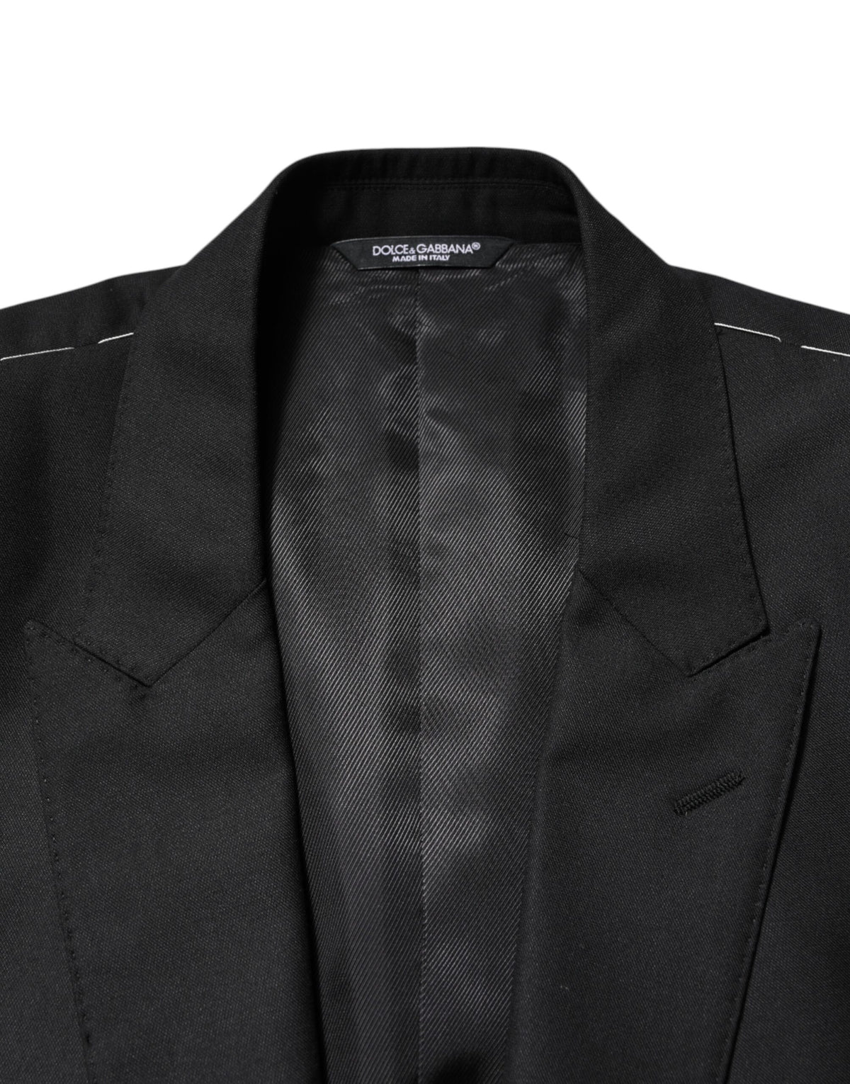 Indulge in the exquisite Dolce & Gabbana Black Wool Single Breasted Jacket Blazer, where luxurious virgin wool and silk meet impeccable craftsmanship for timeless elegance.