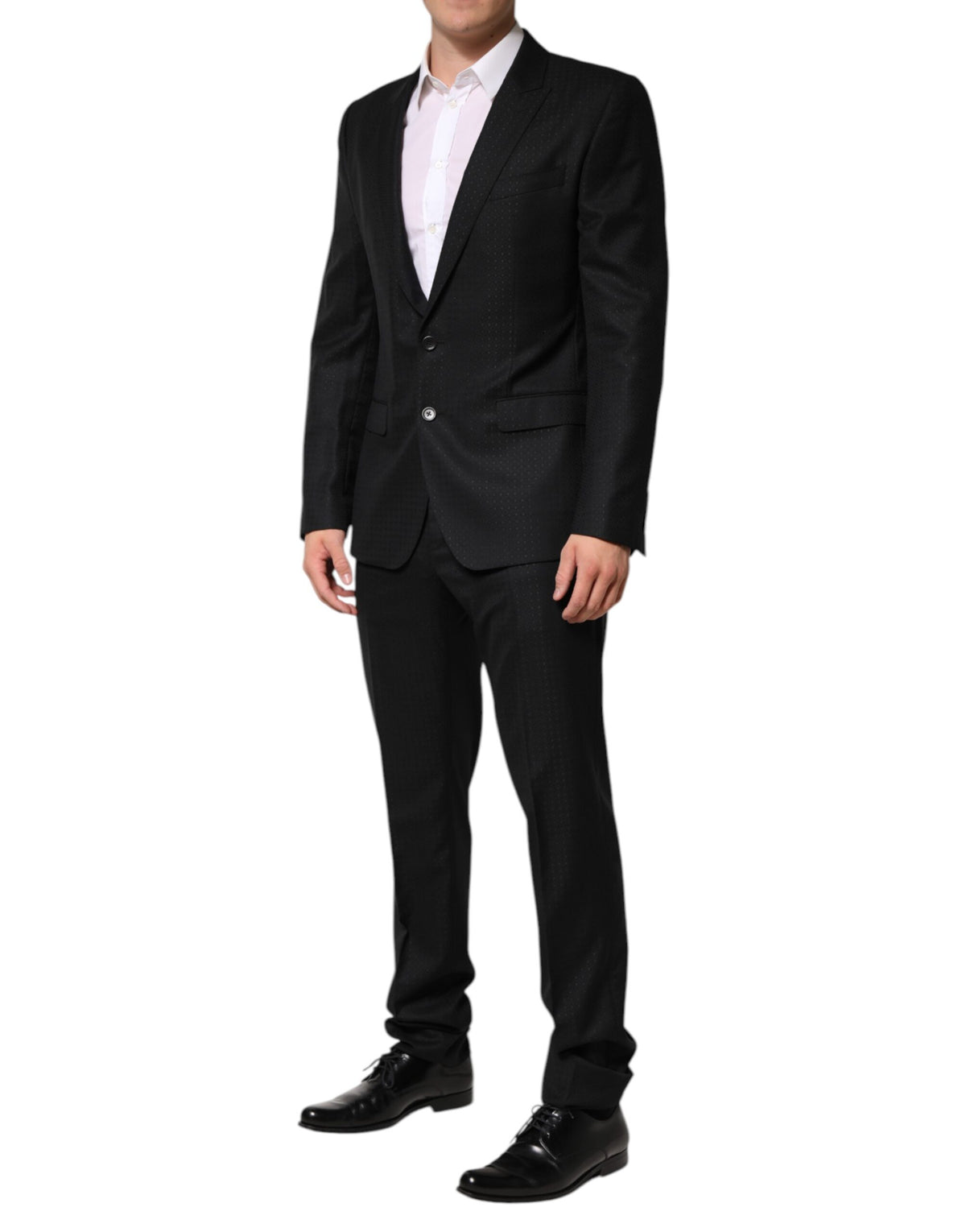 Indulge in the Dolce & Gabbana Black Jacquard 2 Piece Suit, a masterpiece of Italian craftsmanship blending virgin wool and silk for timeless elegance and sophistication.