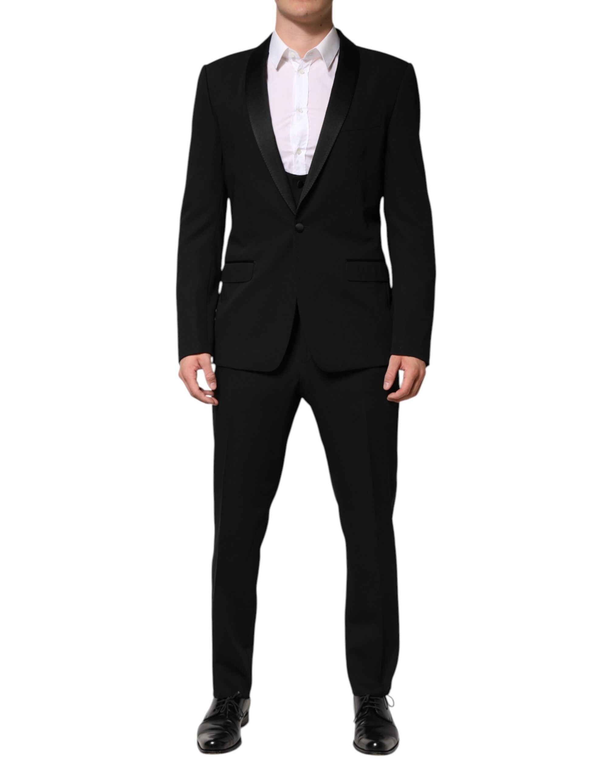 Indulge in the exquisite Dolce & Gabbana Black Wool 3 Piece Suit, a timeless embodiment of luxury and sophistication, crafted from the finest materials for an unparalleled elegance.
