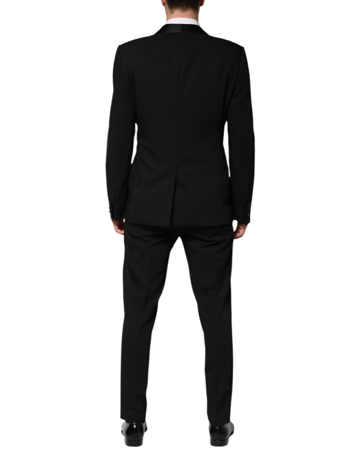 Elevate your wardrobe with the Dolce & Gabbana Black Wool 3 Piece Suit, a masterpiece of artisanal elegance crafted from luxurious virgin wool and silk for timeless sophistication.