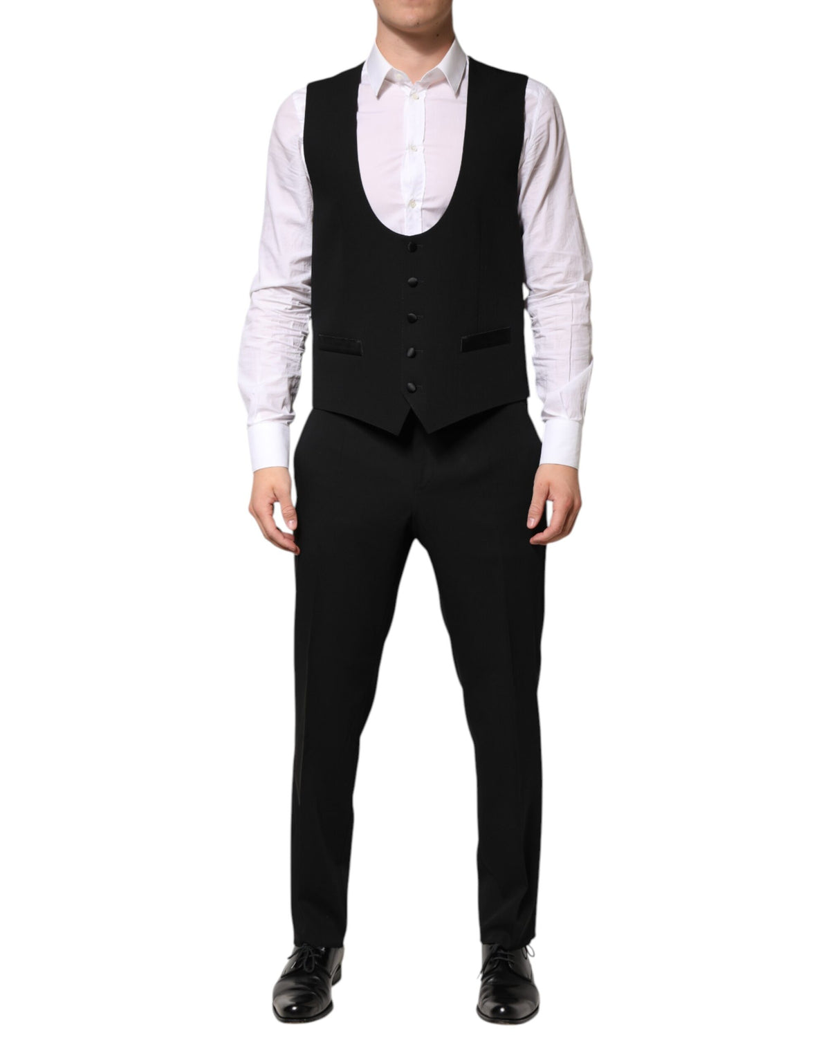 Elevate your wardrobe with the Dolce & Gabbana Black Wool 3 Piece Suit, a masterpiece of artisanal elegance crafted from premium materials for timeless sophistication.