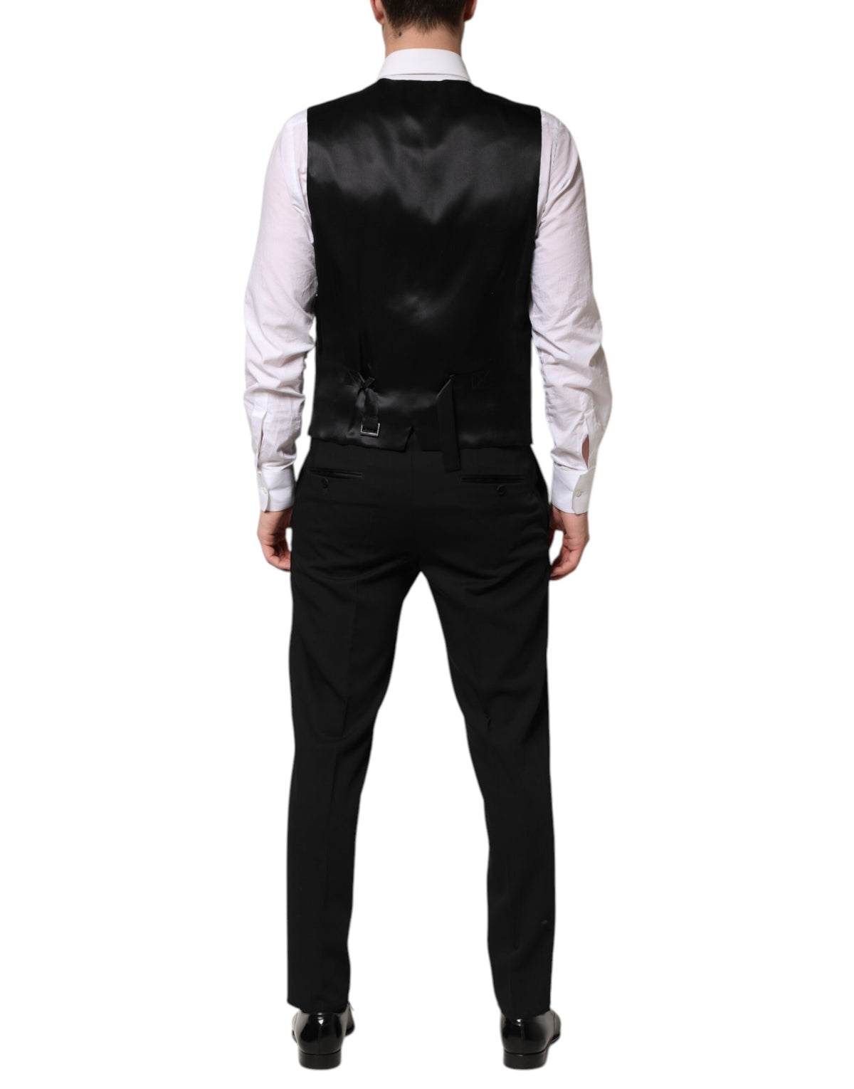 Elevate your wardrobe with the Dolce & Gabbana Black Wool 3 Piece Suit, a masterful blend of virgin wool and silk, embodying timeless luxury and sophisticated elegance.