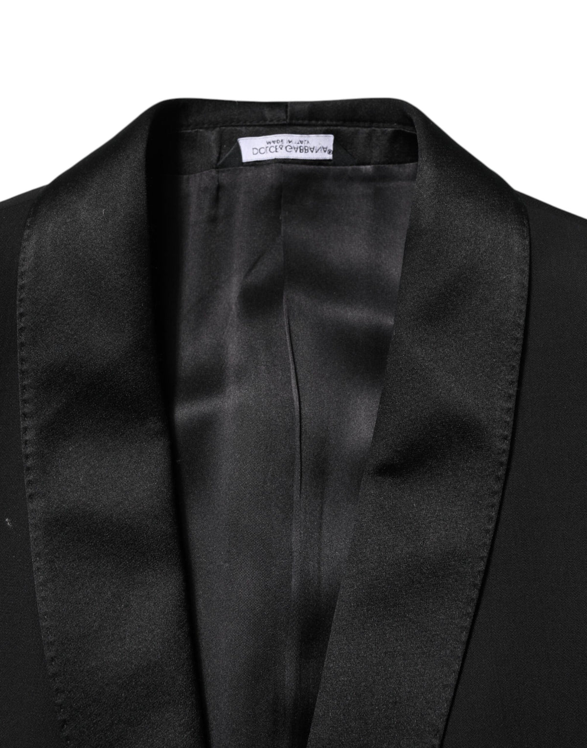Experience the exquisite craftsmanship of the Dolce & Gabbana Black Wool 3 Piece Suit, a timeless luxury that embodies sophistication and elegance for any discerning individual.
