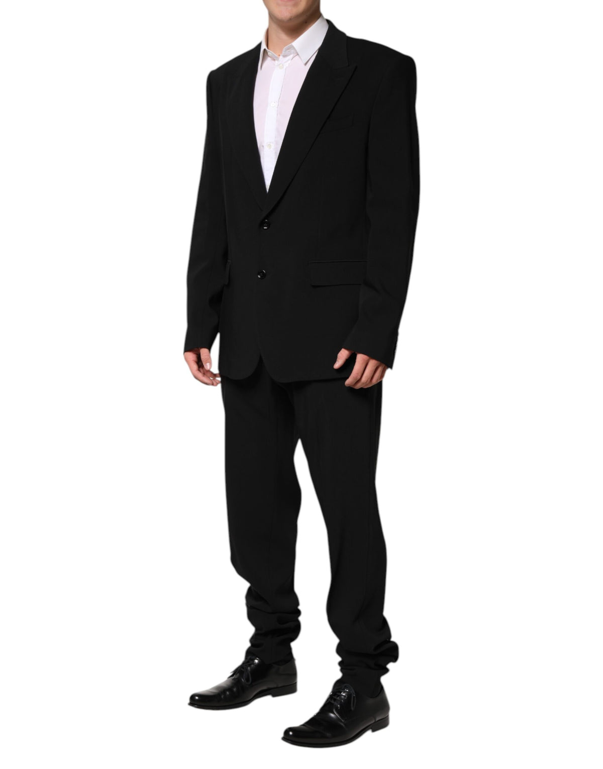 Experience the allure of Dolce & Gabbana's Black Cotton Single Breasted 2 Piece Suit, a masterpiece of Italian craftsmanship that embodies timeless elegance and sophisticated luxury.