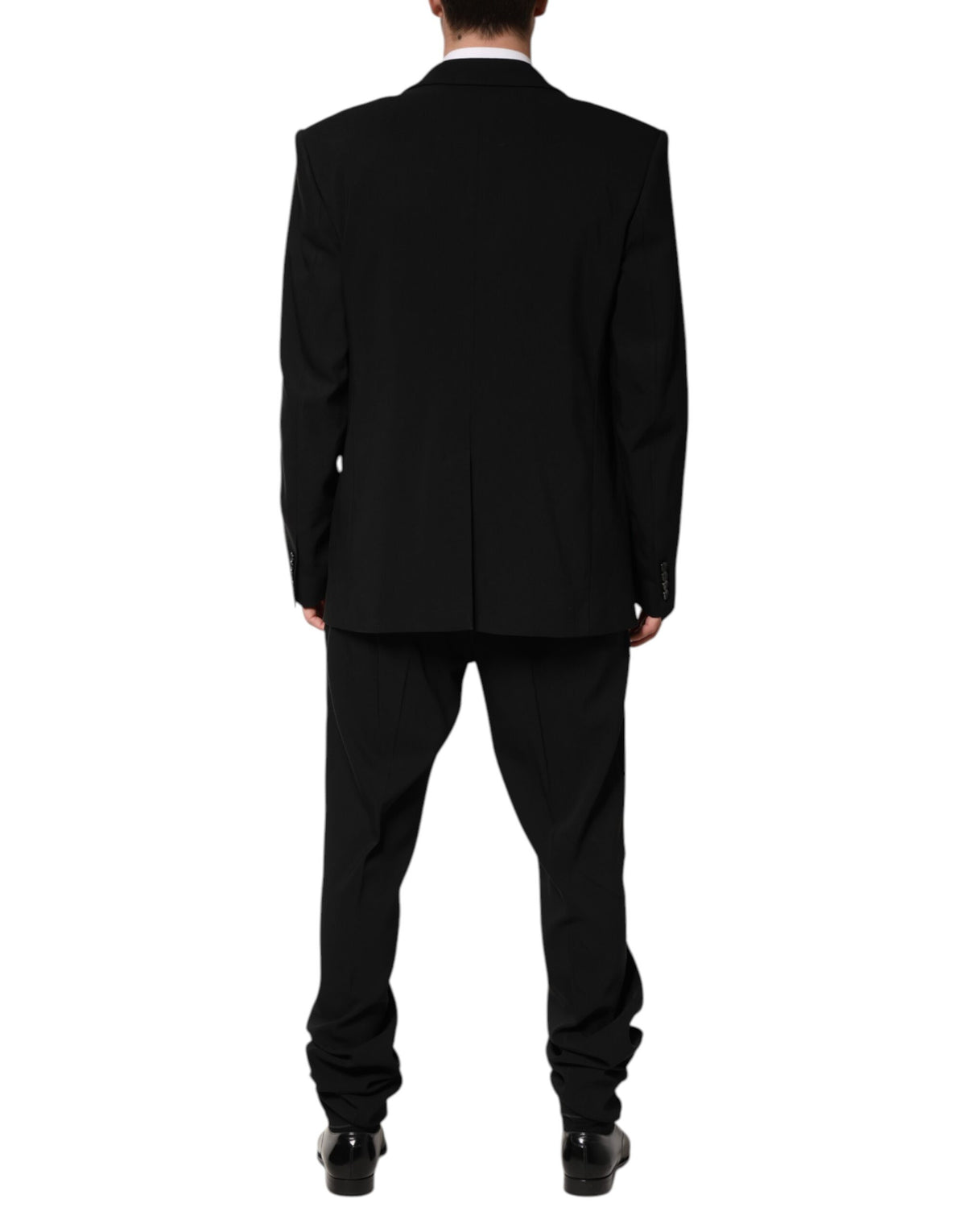 Elevate your wardrobe with the Dolce & Gabbana Black Cotton Single Breasted 2 Piece Suit, a masterpiece of Italian craftsmanship that embodies timeless elegance and sophisticated allure.
