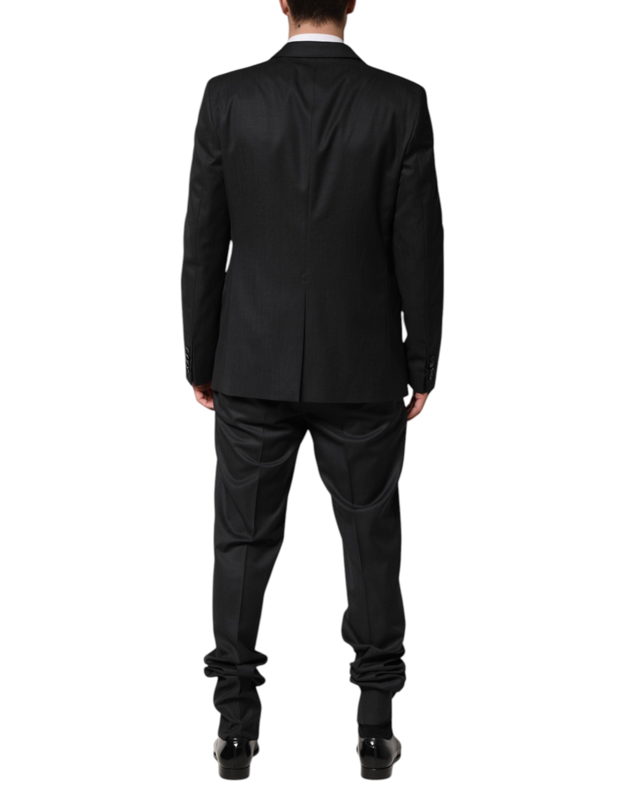 Elevate your wardrobe with the Dolce & Gabbana Dark Gray Wool Suit, a masterpiece of Italian craftsmanship in luxurious virgin wool, perfect for unforgettable moments.