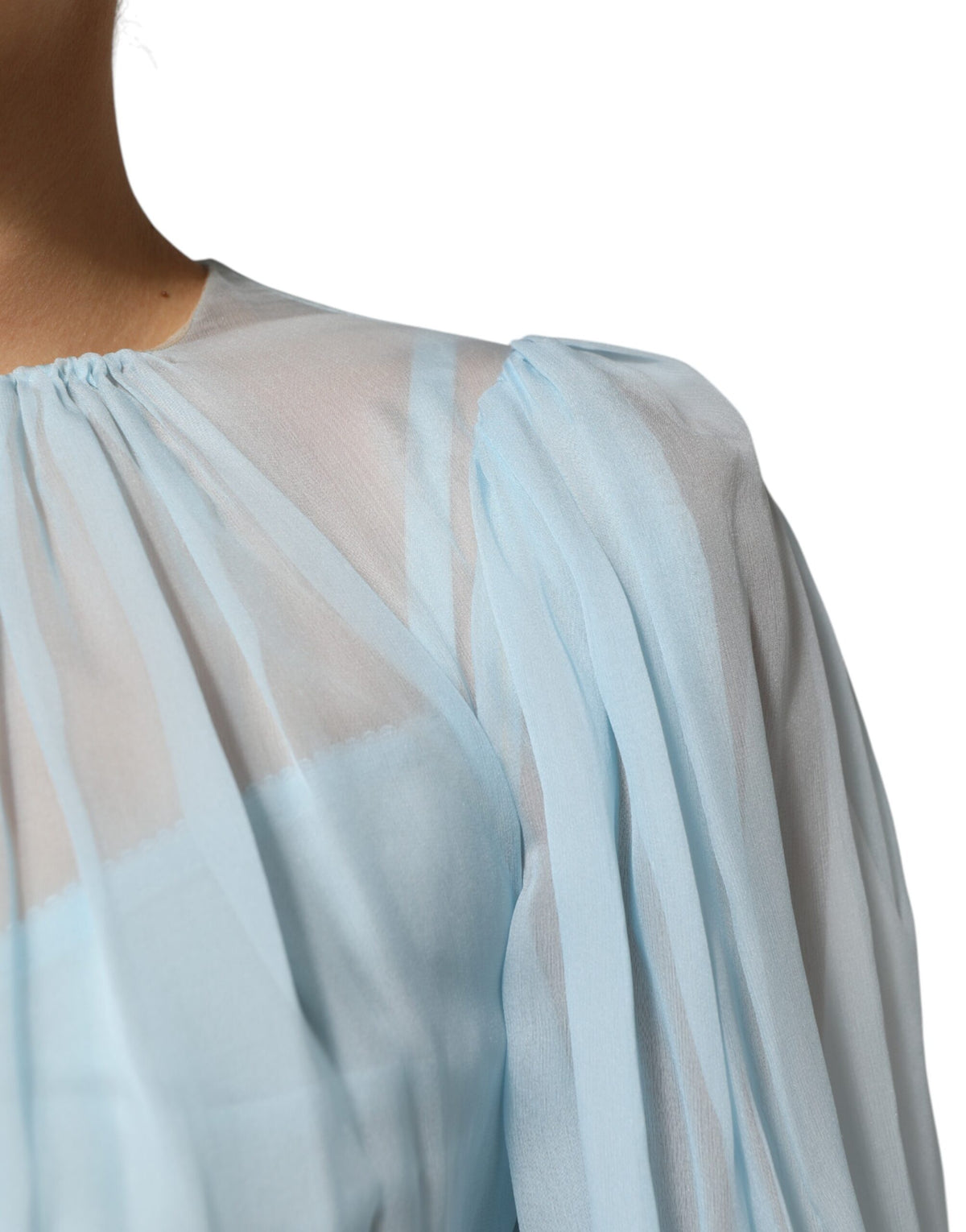 Indulge in the exquisite Dolce & Gabbana Fuchsia Light Blue Silk Midi Dress, a masterpiece of craftsmanship that elevates elegance and allure for the discerning individual.