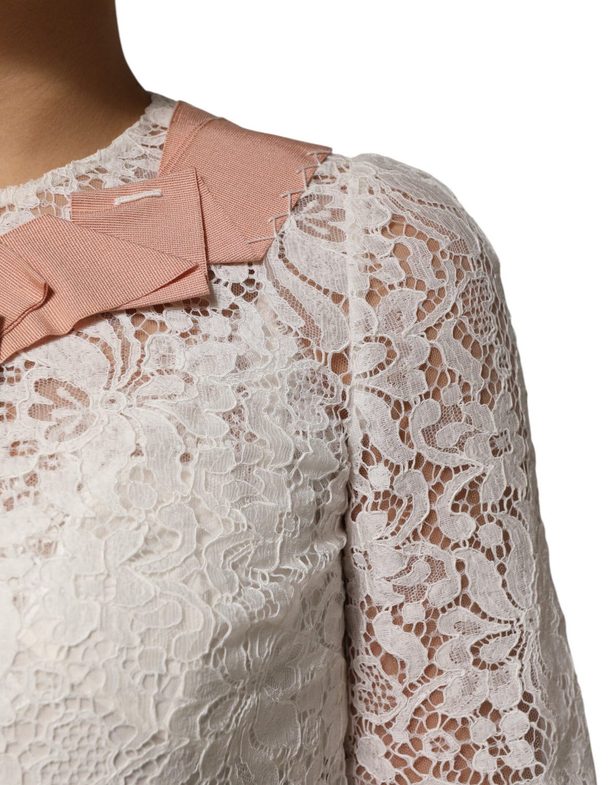 Experience the allure of the Dolce & Gabbana White Floral Lace Blouse Top, where exquisite craftsmanship meets luxurious materials, perfect for the discerning wardrobe.