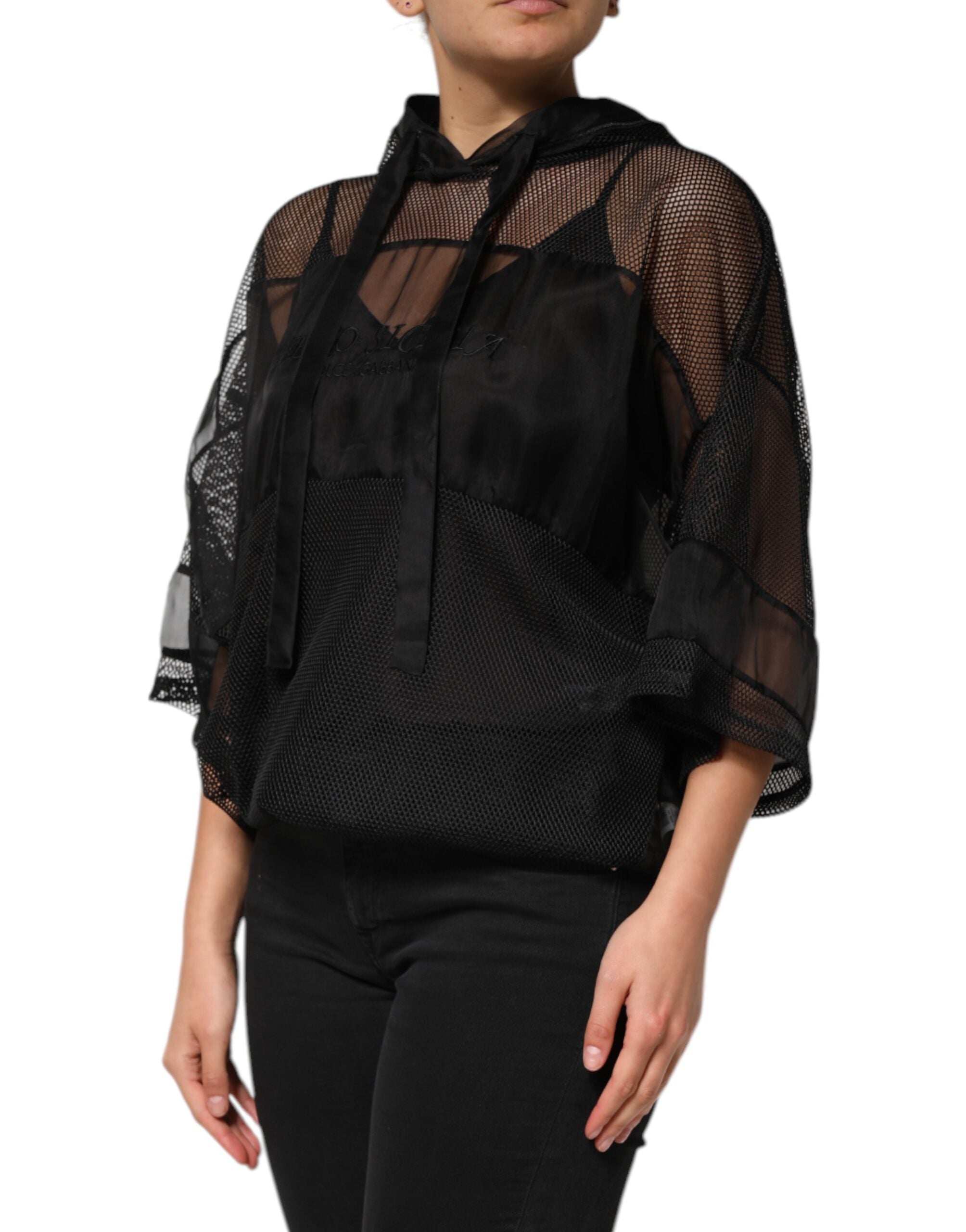 Indulge in the exquisite Dolce & Gabbana Black See Through Hooded Pullover Sweater, a luxurious blend of silk and polyester, embodying timeless elegance and sophisticated allure.