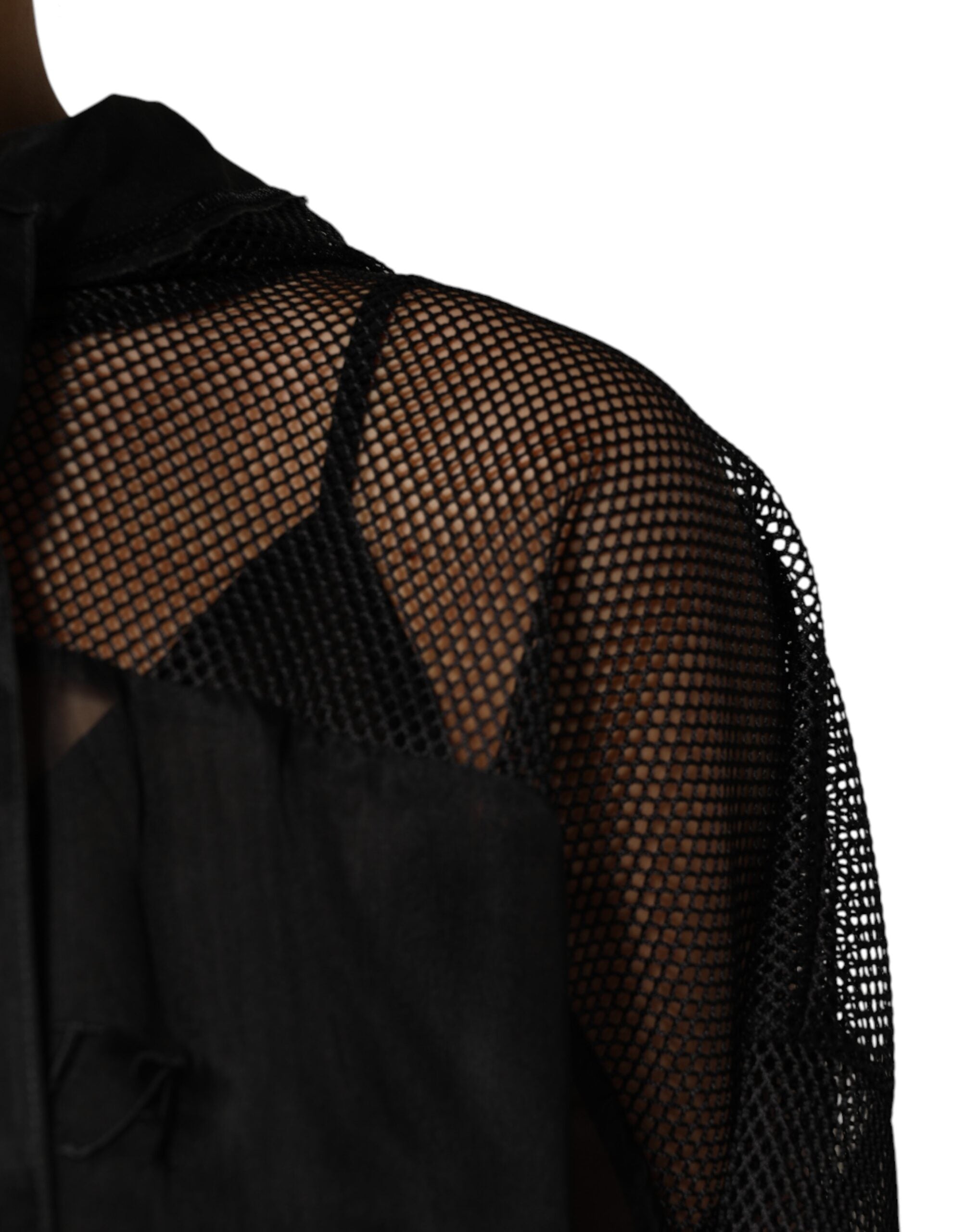 Indulge in the exquisite allure of the Dolce & Gabbana Black See Through Hooded Pullover Sweater, a luxurious blend of silk and polyester, embodying timeless elegance and refined craftsmanship.