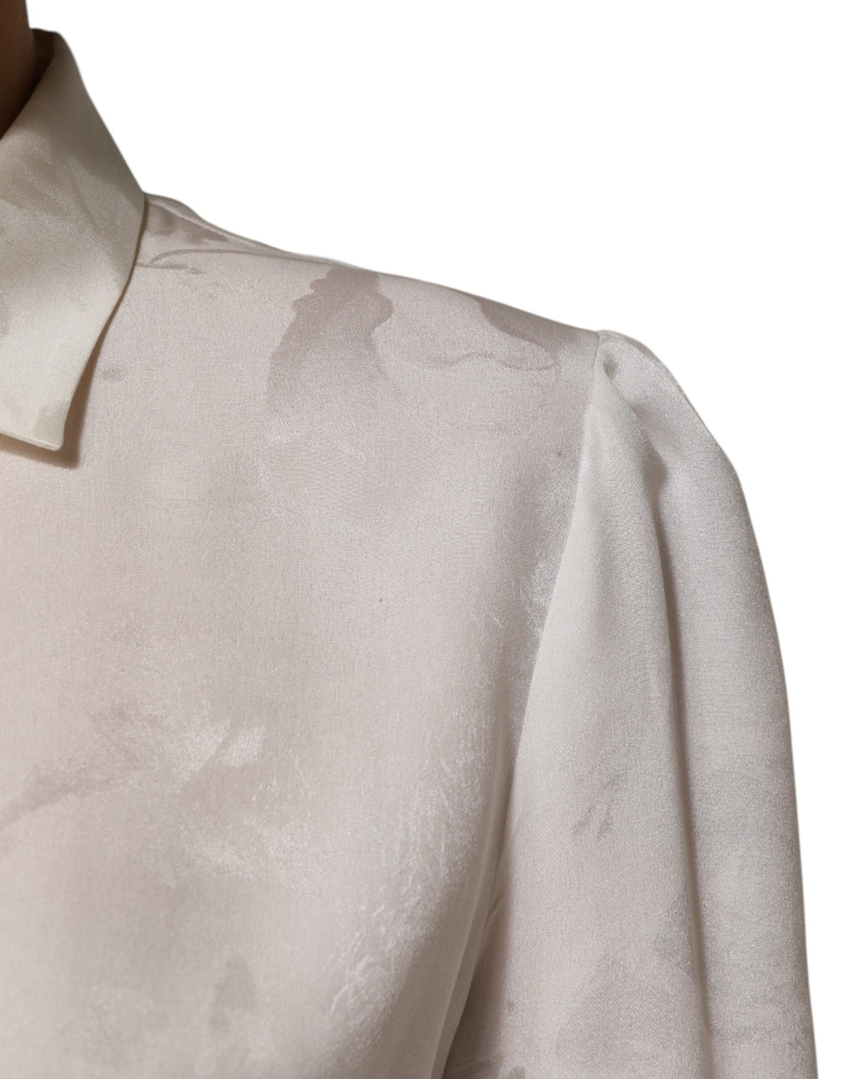 Discover the Dolce & Gabbana White Silk Long Sleeves Collared Shirt Top, a masterpiece of Italian craftsmanship that redefines luxury and elegance for the discerning individual.