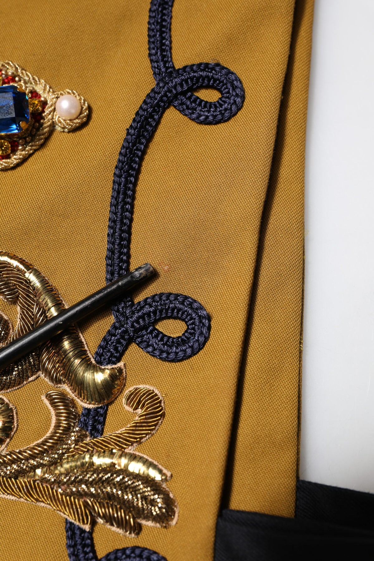 Discover the Dolce & Gabbana Yellow Crystal Cross Runway Vest, a luxurious blend of cotton and elastane, embodying exquisite Italian craftsmanship and haute couture elegance.