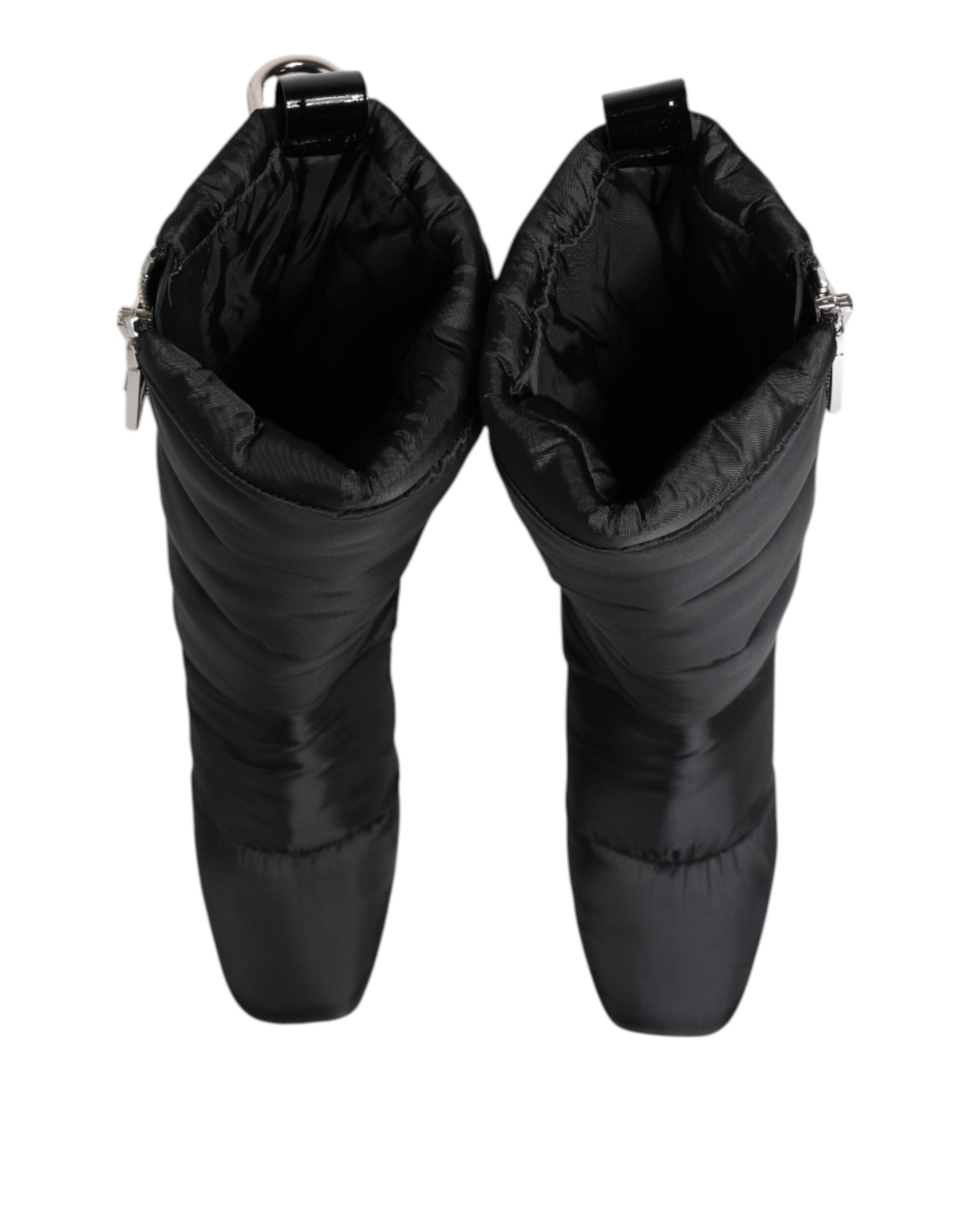 Elevate your style with Dolce & Gabbana's Black Padded Mid Calf Logo Heel Boots, a luxurious blend of exquisite craftsmanship and timeless elegance, perfect for any occasion.
