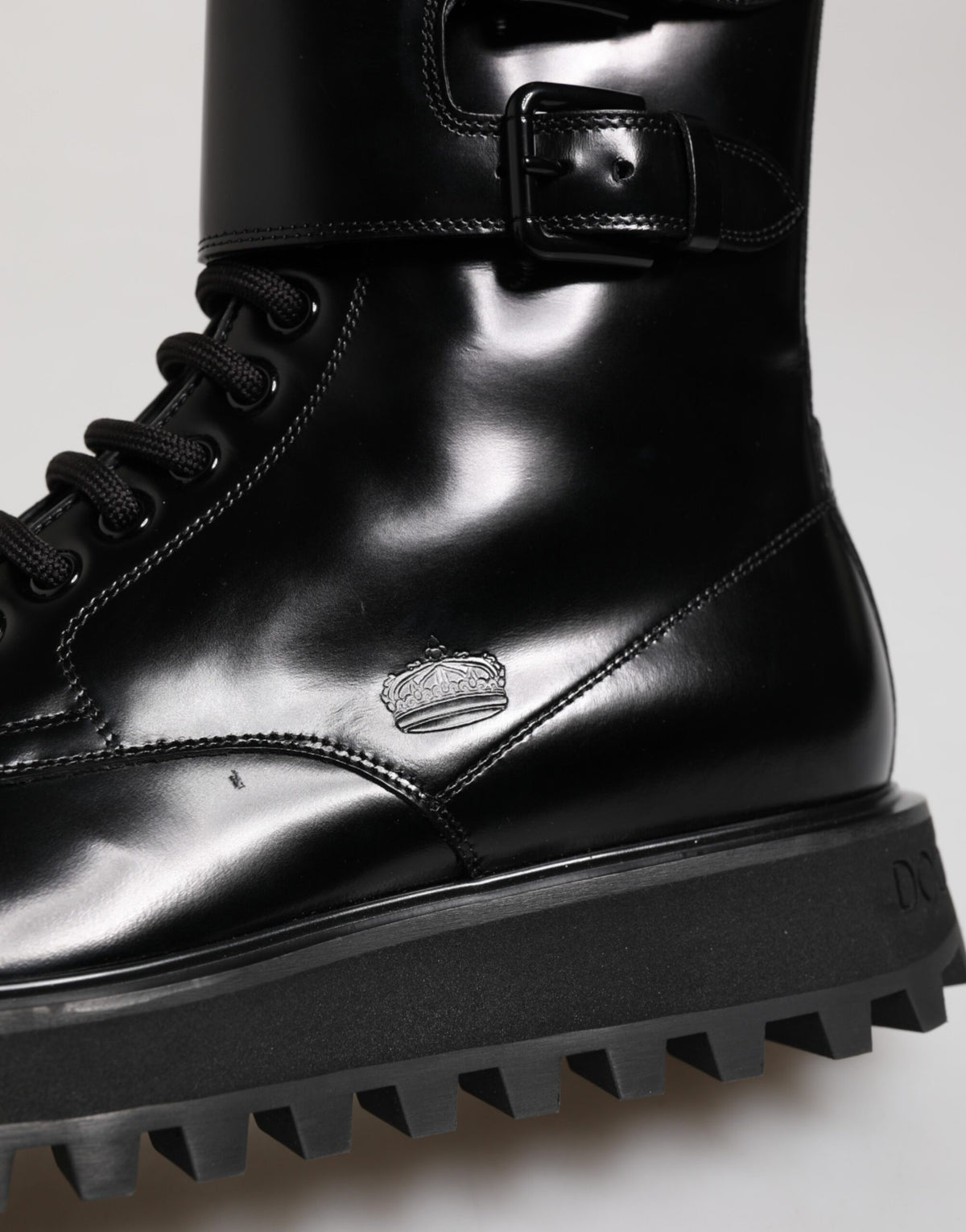 Indulge in the exquisite craftsmanship of Dolce & Gabbana's Black Leather Lace Up Mid Calf Boots, a luxurious blend of style and sophistication for the discerning individual.